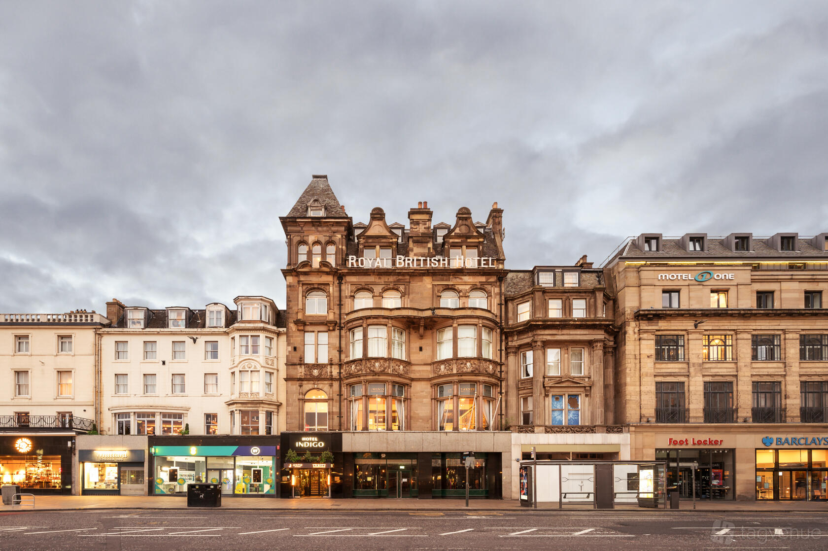 A historic hotel building with ornate stonework and large windows at Hotel Indigo Edinburgh - Princes Street.