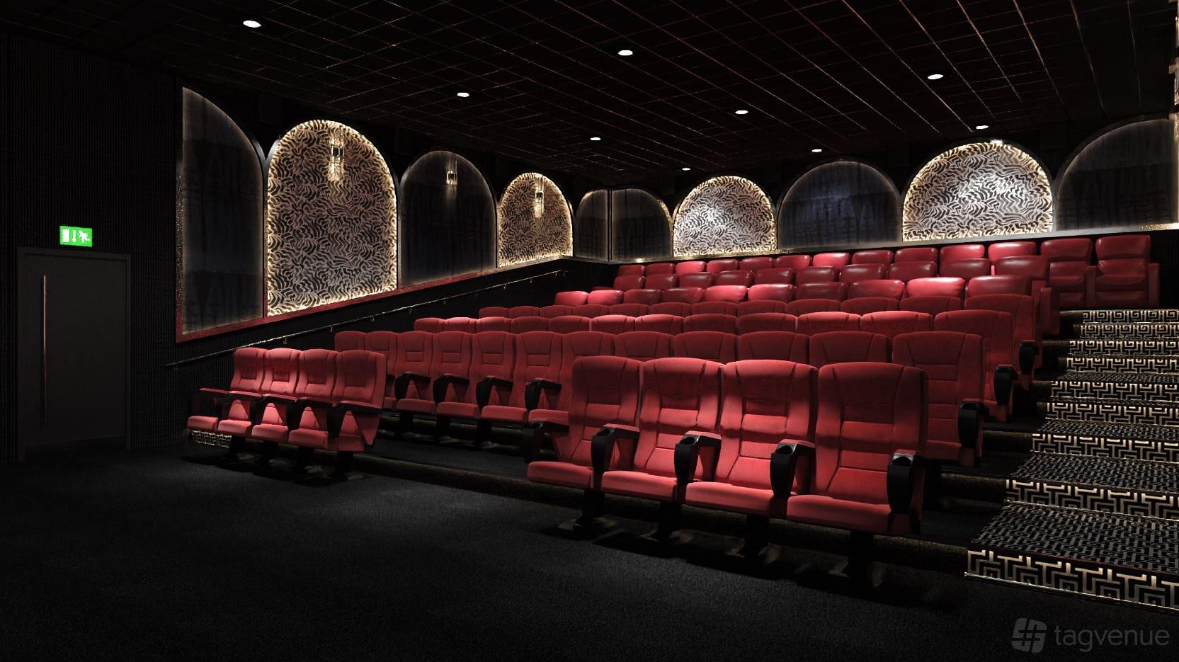 A cinema screening room with red tiered seating, patterned wall panels, and ambient lighting at Roxy Movies Middlesbrough.