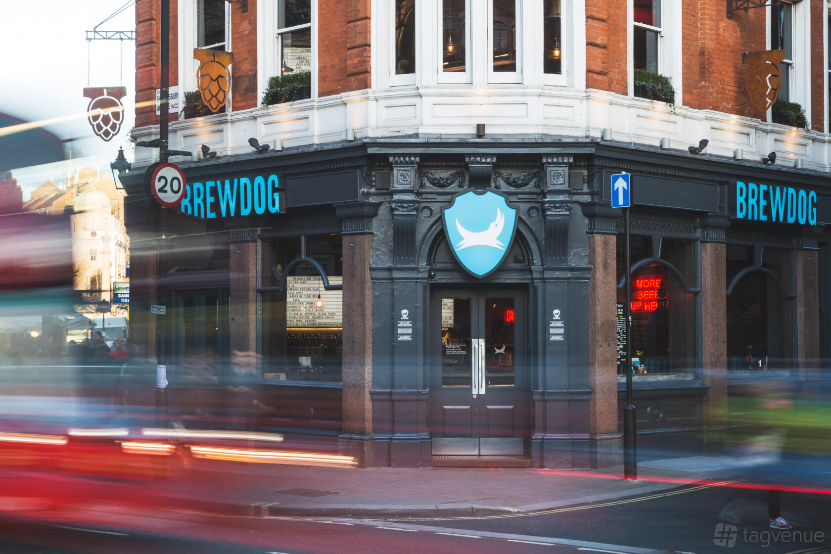 A corner pub with brick exterior, large windows, and BrewDog signage at BrewDog Seven Dials.