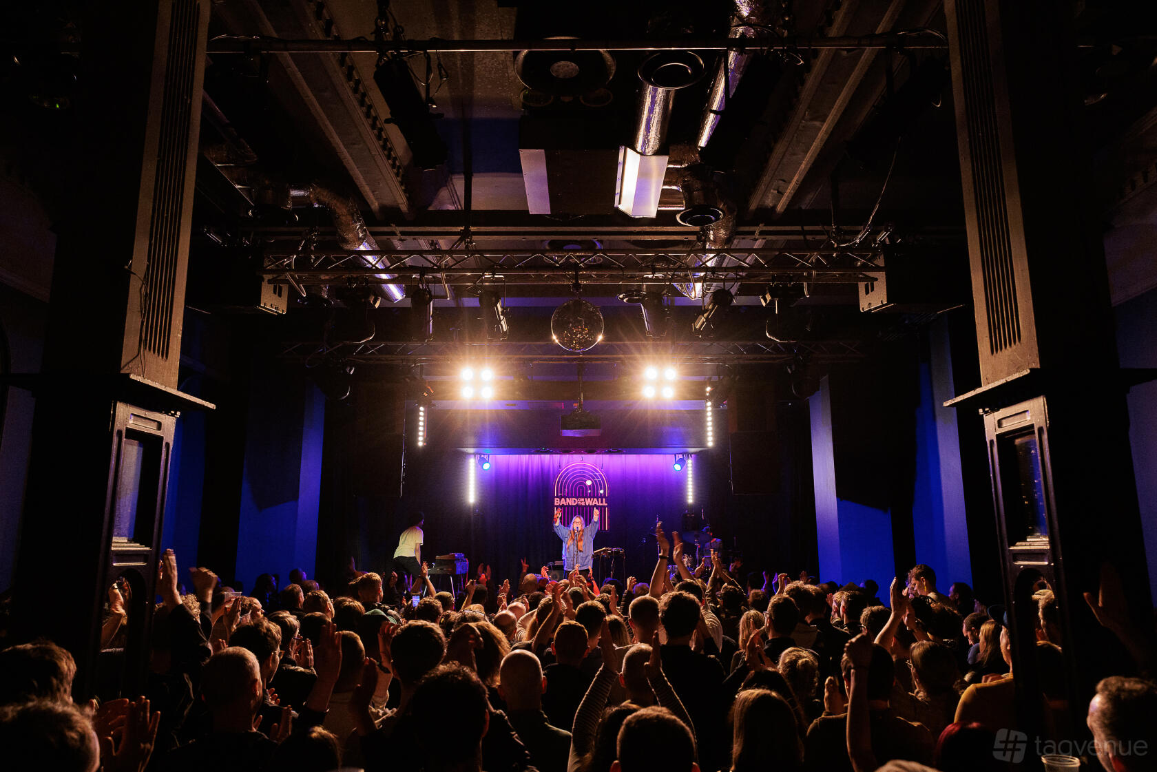 A live music venue with a stage, audience area, professional lighting, and crowd at Band on the Wall.