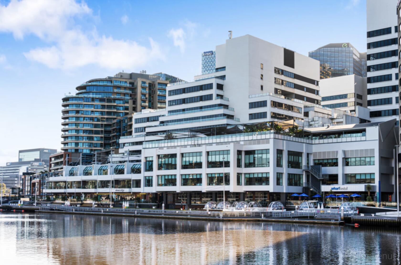 A gallery building with large glass windows and a waterfront location at Creative Asia Art Centre.