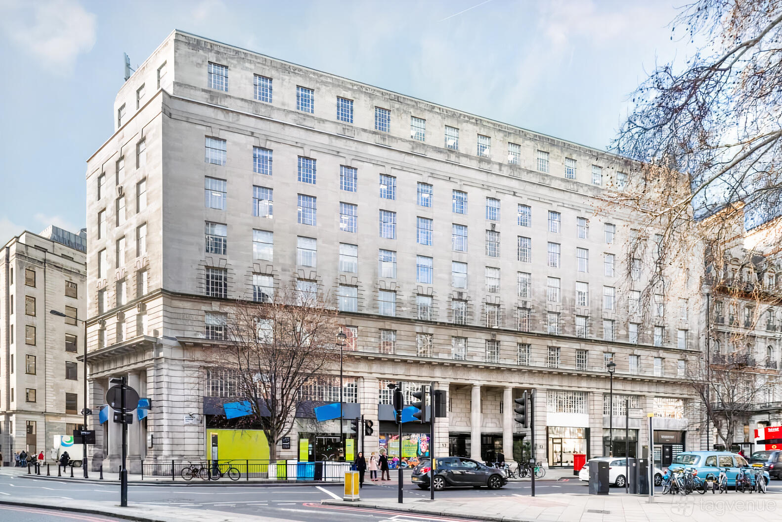 A meeting centre with a grand stone facade and large windows at Regus - London, Victoria - Grosvenor Gardens.