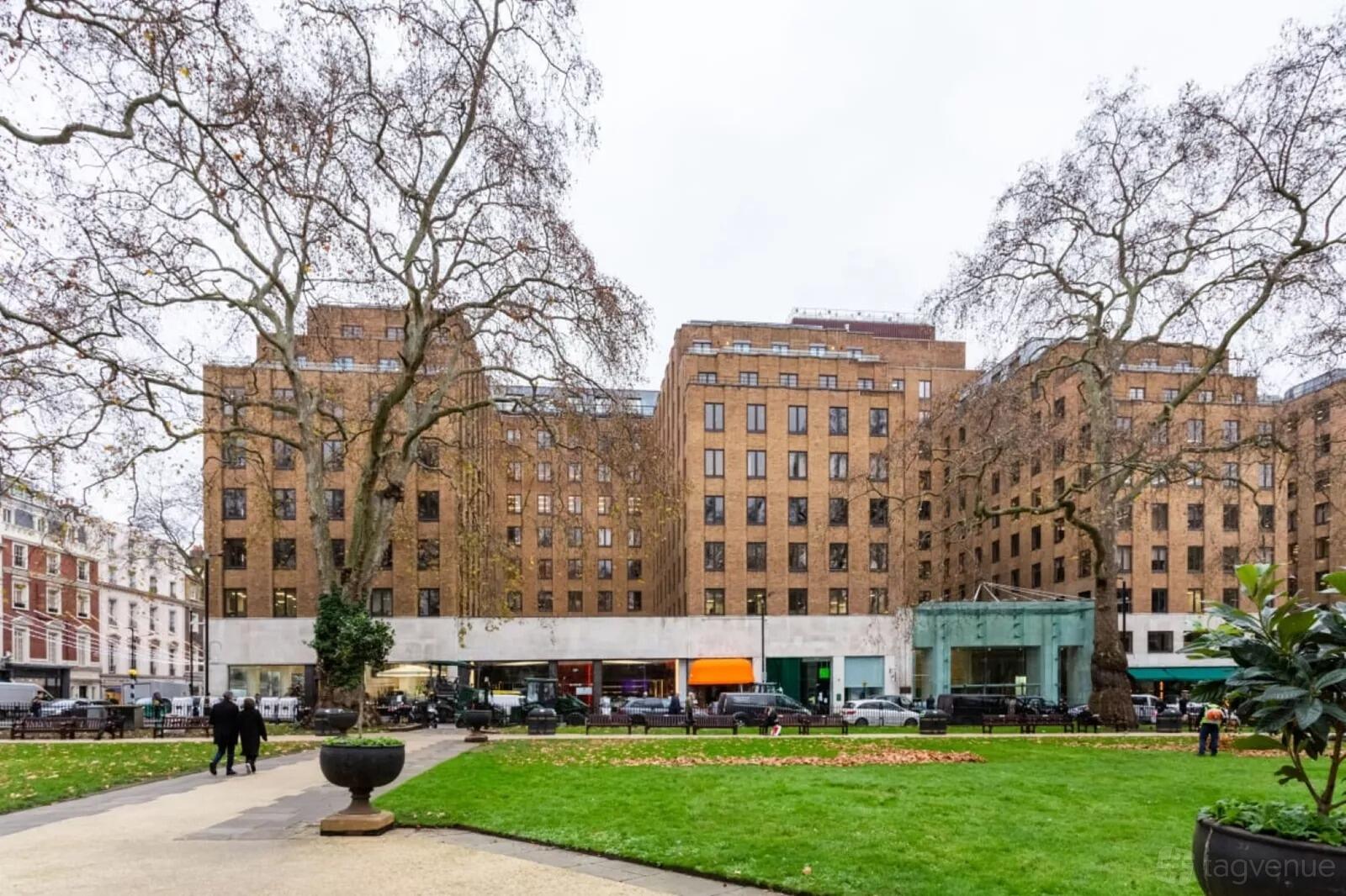A meeting centre with an art deco brick facade facing a landscaped square at Signature by Regus - London Berkeley Square.