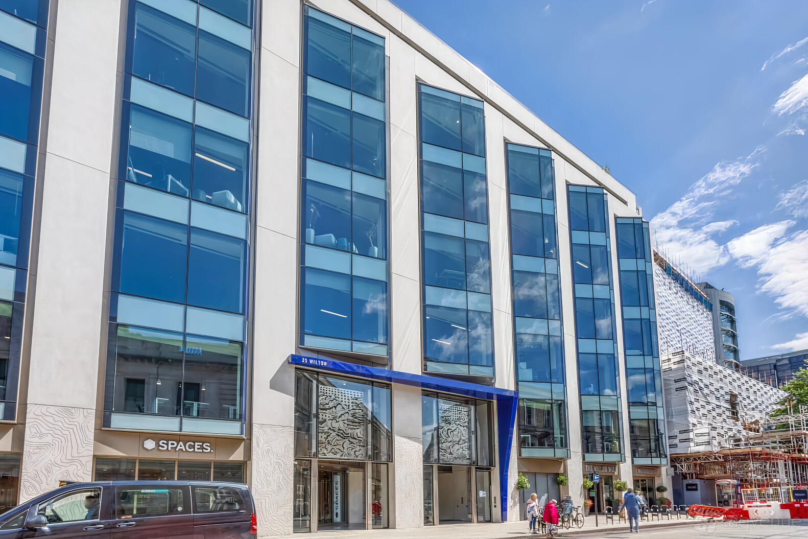 A meeting centre with a glass facade and multiple floors at Spaces - London, Spaces Victoria.