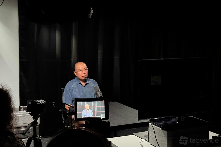 Cambridge Podcast Zone with guest, camera and podcast microphone