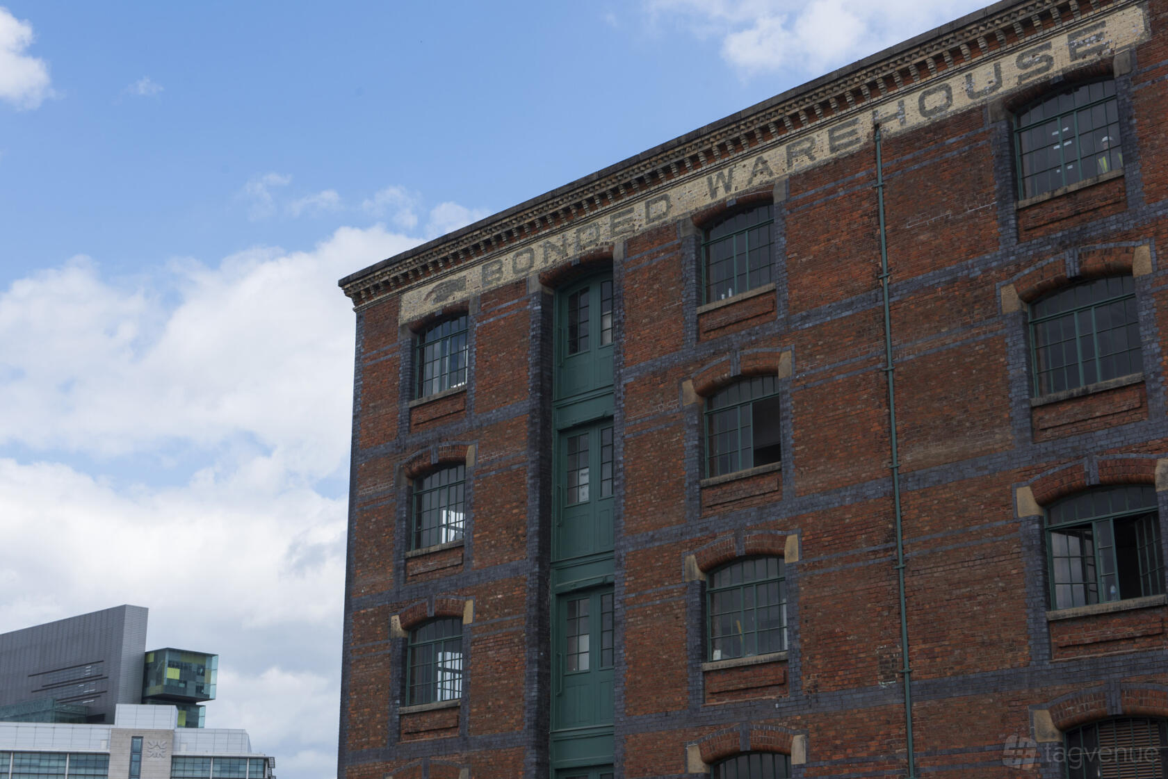 A historic warehouse with red brick exterior and painted signage at Department Bonded Warehouse.