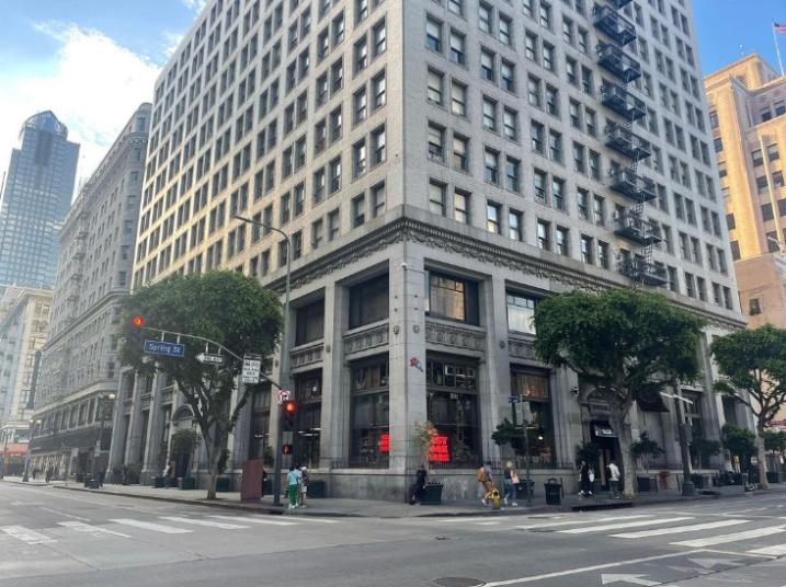 A historic corner building with large windows and street-level signage at Ice Cream Sound Studios.