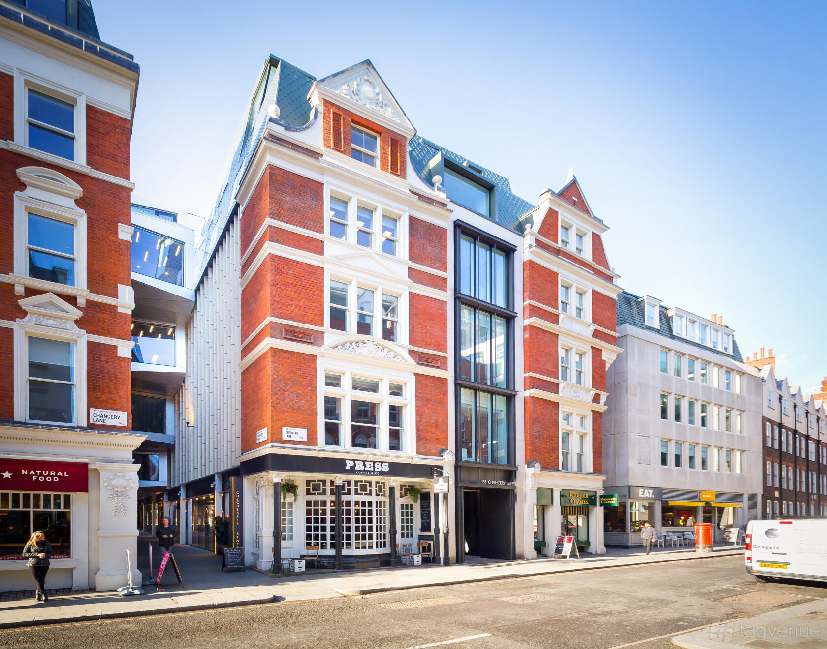 A meeting centre with a red brick facade, large windows, and ornate white trim at Landmark: Chancery Lane, London.