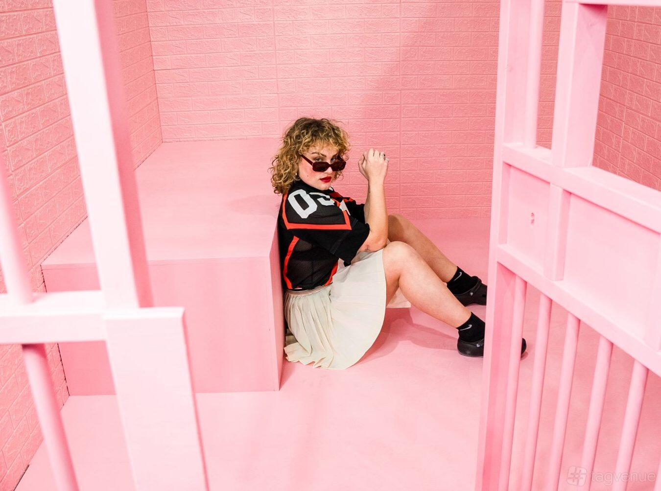 An event venue with bright pink walls, geometric installations, and playful decor at Selfie Factory.