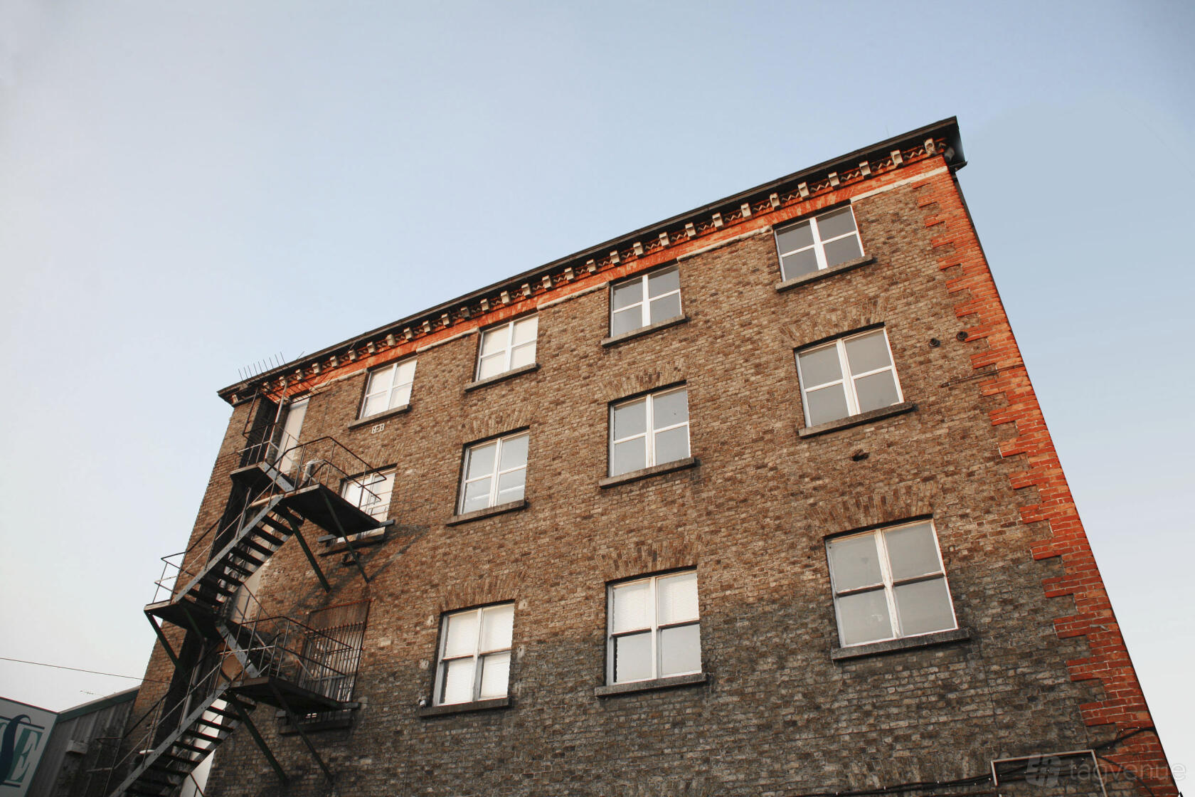 A film and photo studio with a brick exterior and metal fire escape at Mill Studios.