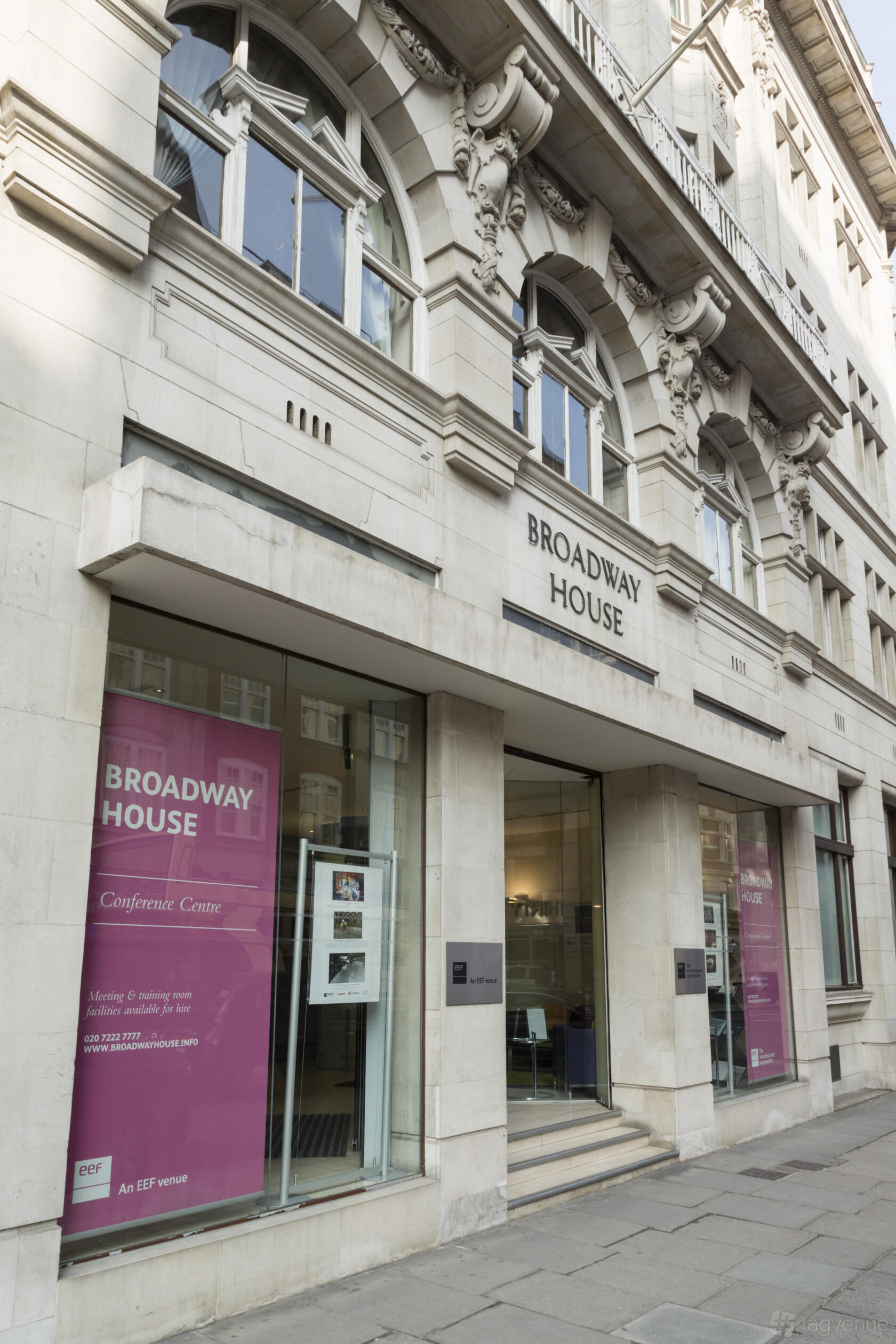 A conference centre with large street-facing windows and classical stone facade at Broadway House.