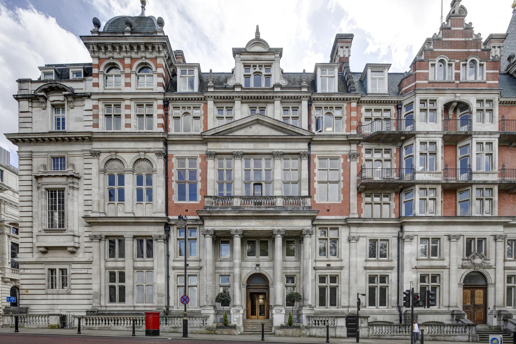 A historic meeting centre with ornate stone façade, large windows, and classical architectural details at One Birdcage Walk.