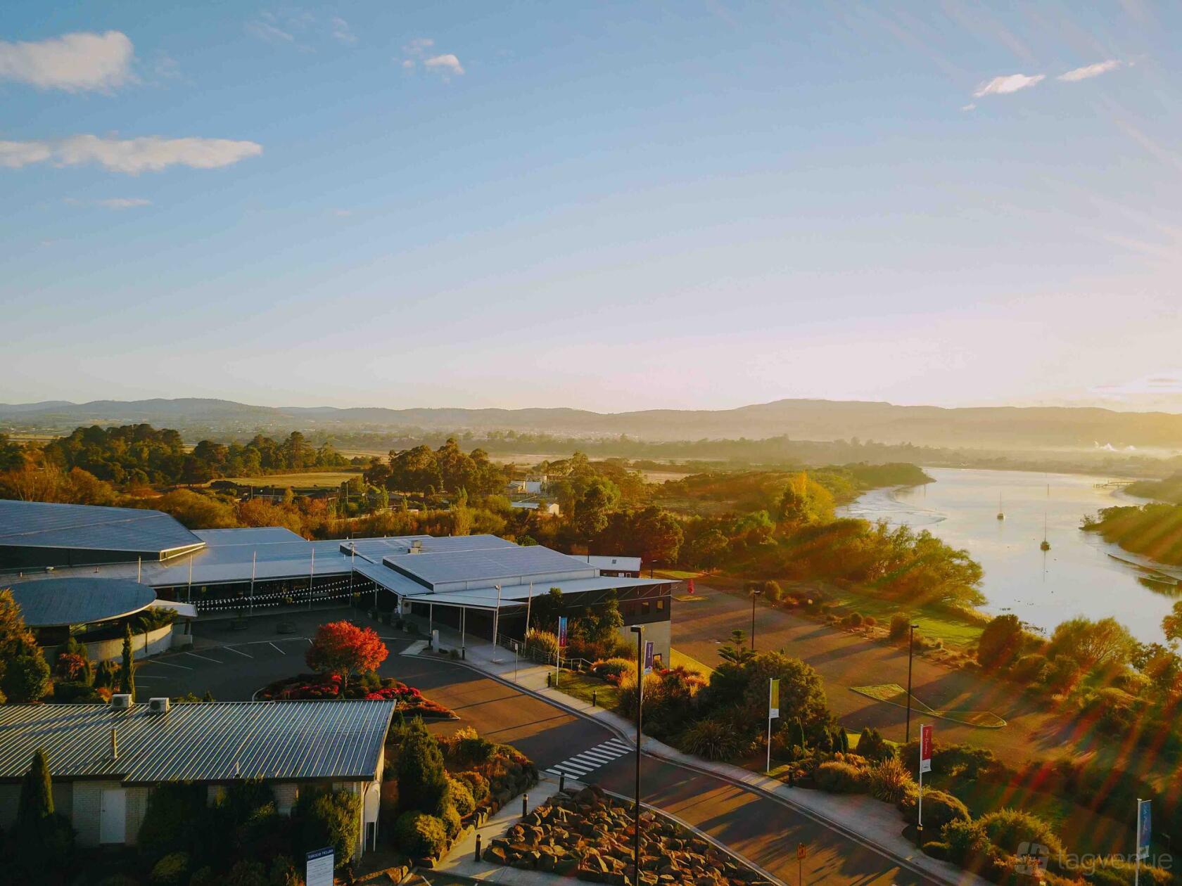 A versatile event space with modern buildings, landscaped gardens, and riverside views at Tailrace Centre.