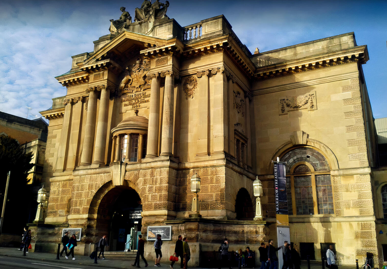 A historic museum with ornate stone columns, arched entryway, and statues at Bristol Museum & Art Gallery.
