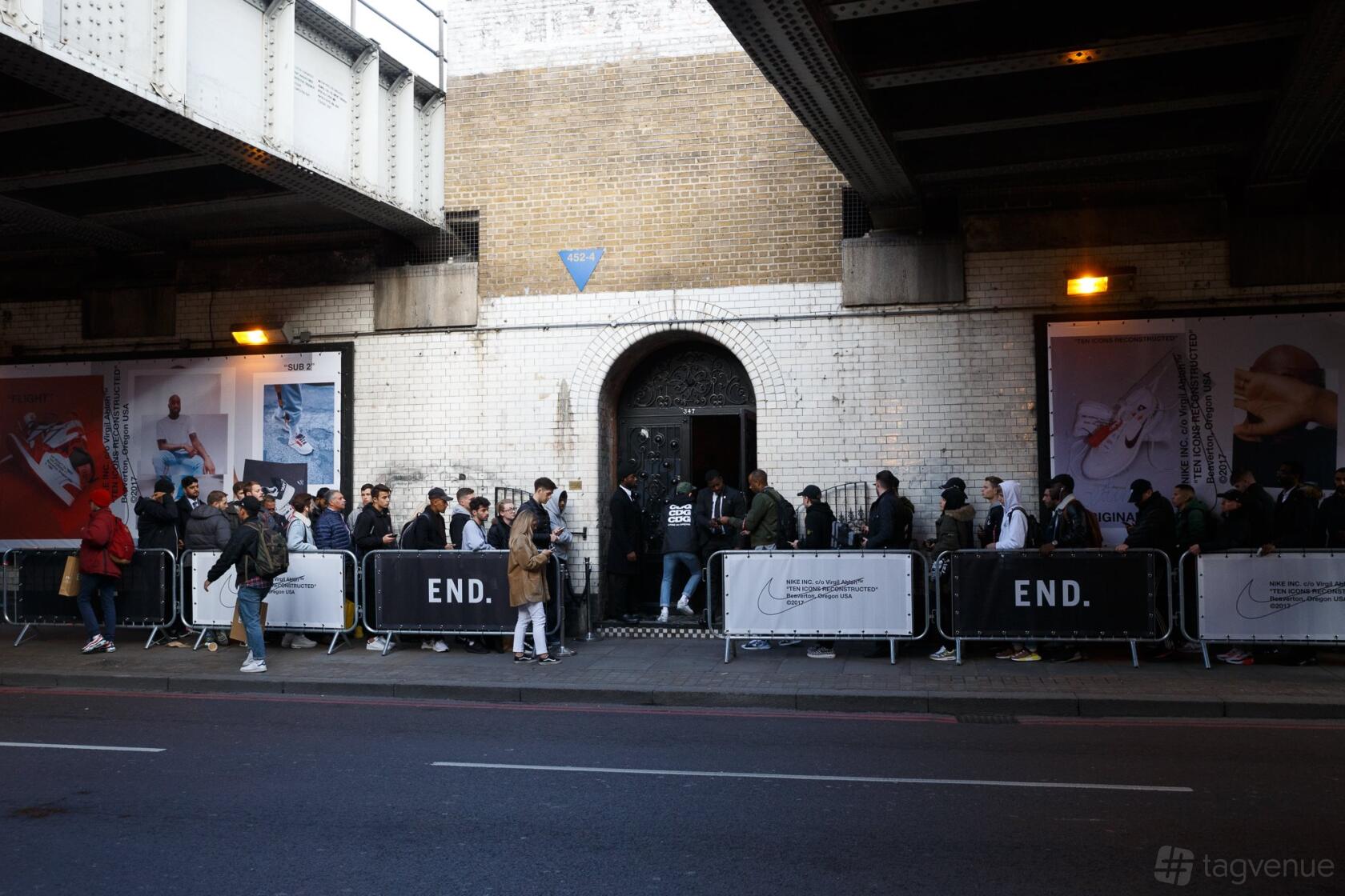 A railway arch venue with a brick facade and arched doorway underneath a bridge at Kachette.