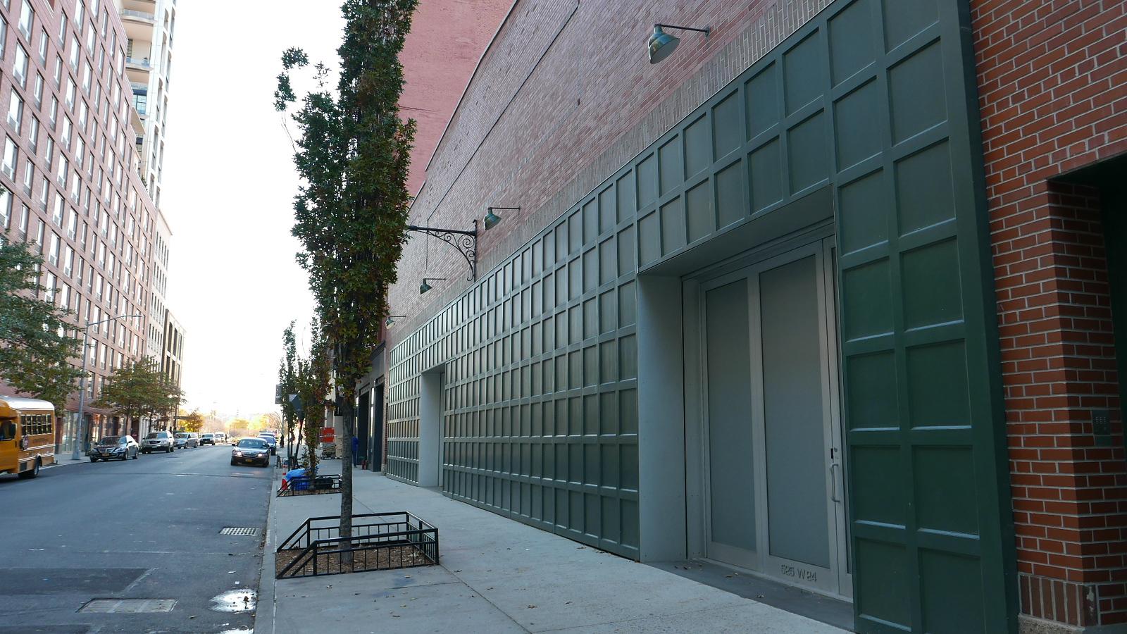 A versatile event space with a modern gray grid-pattern exterior and large entry doors at Studio 525.
