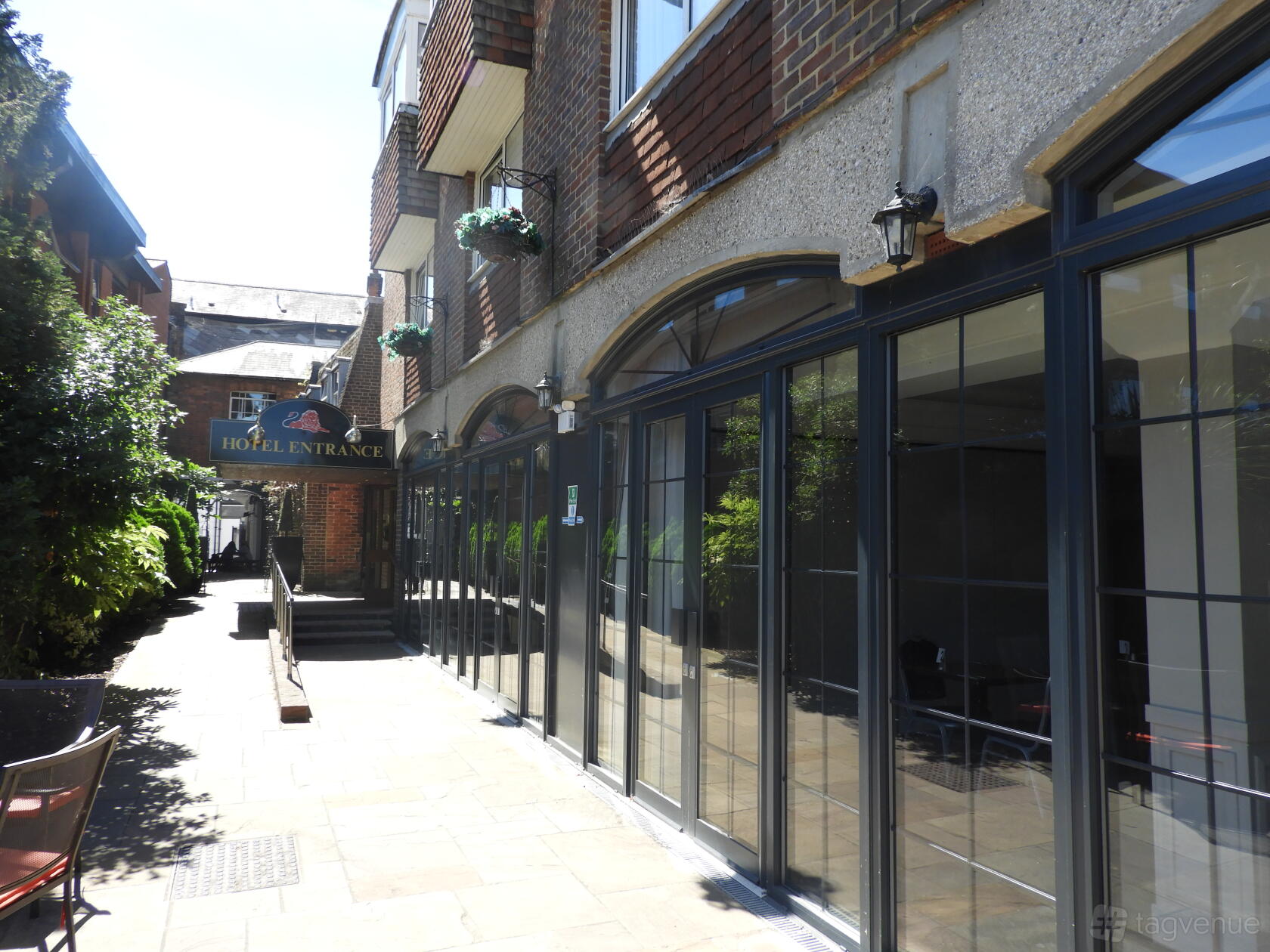 A versatile event space with large glass doors and brick exterior at Red Lion Hotel