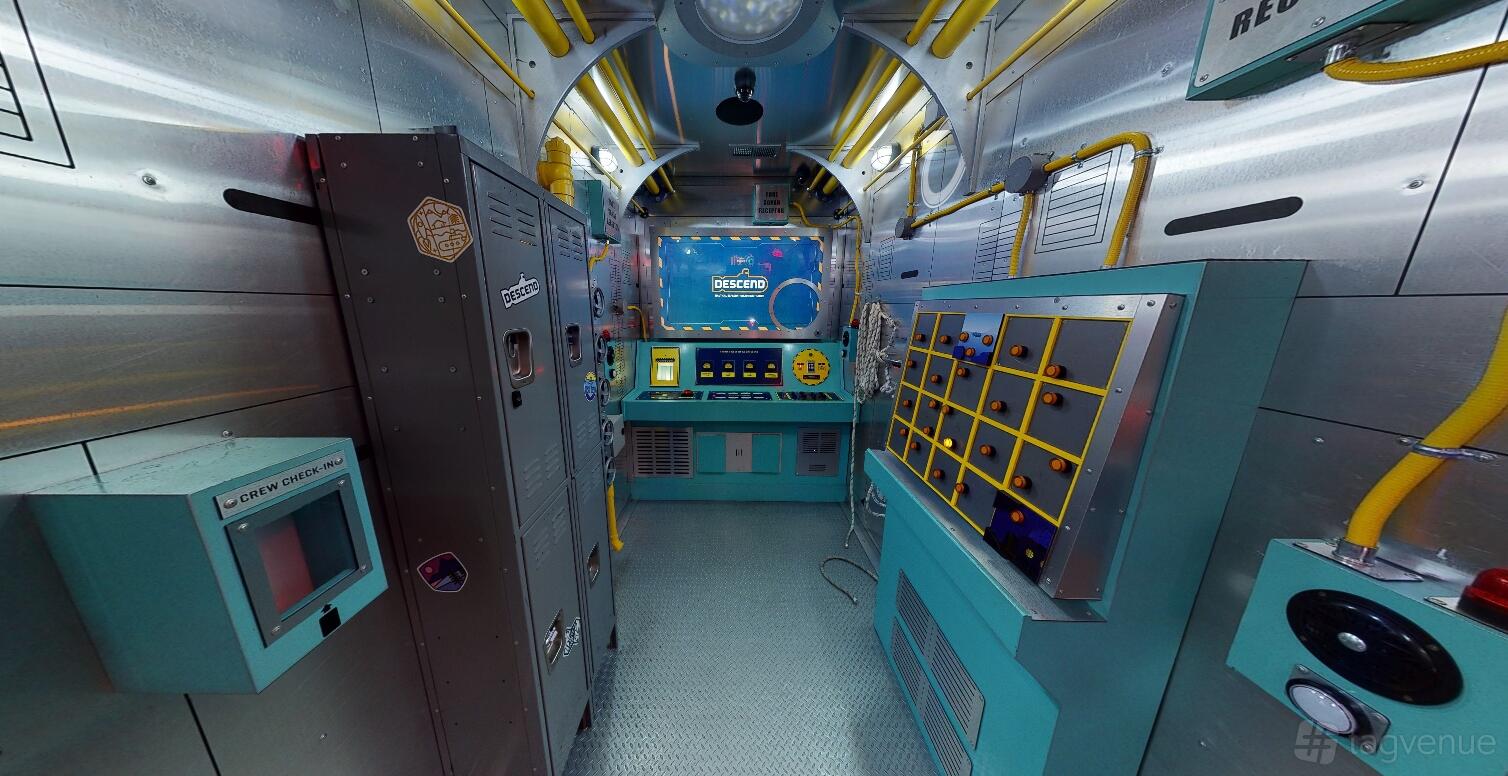 An event venue with themed control panels, lockers, and submarine decor at The Escape Game Houston- The Galleria.