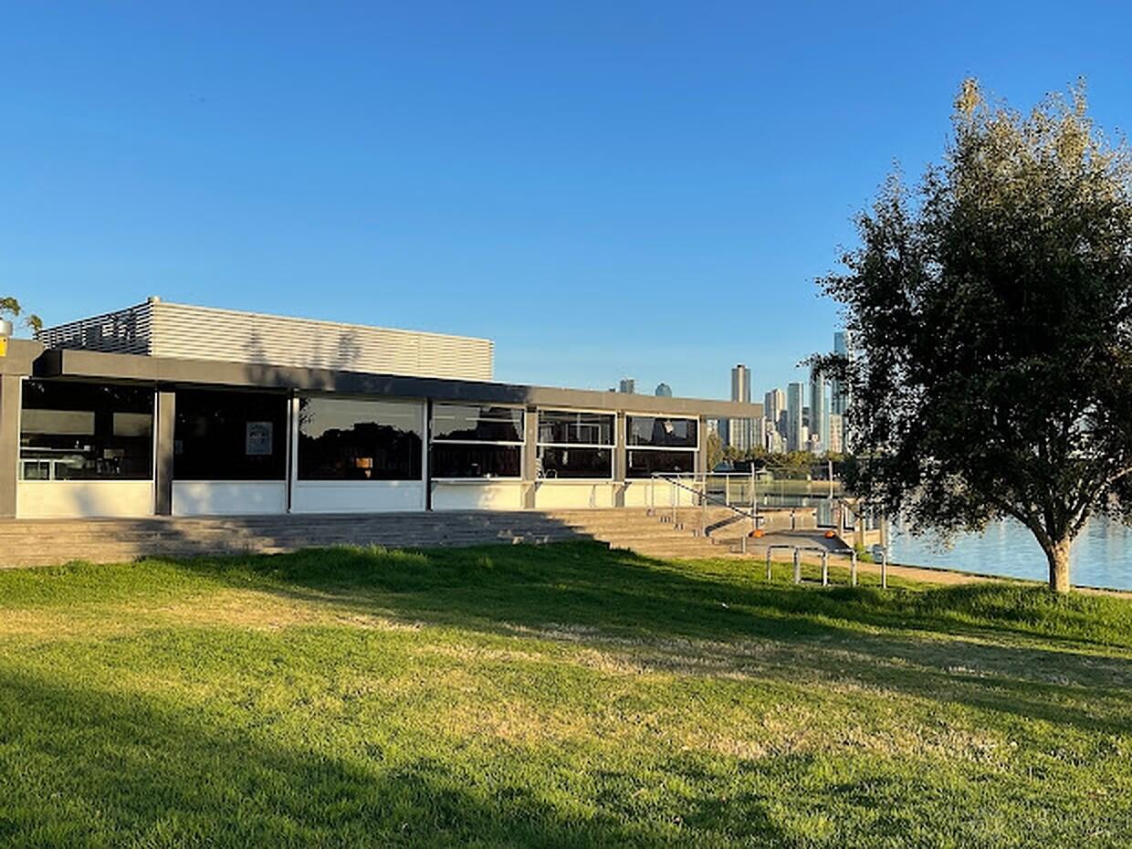 A versatile event space with large glass windows, a ramp entrance, and a riverside lawn at Carousel.