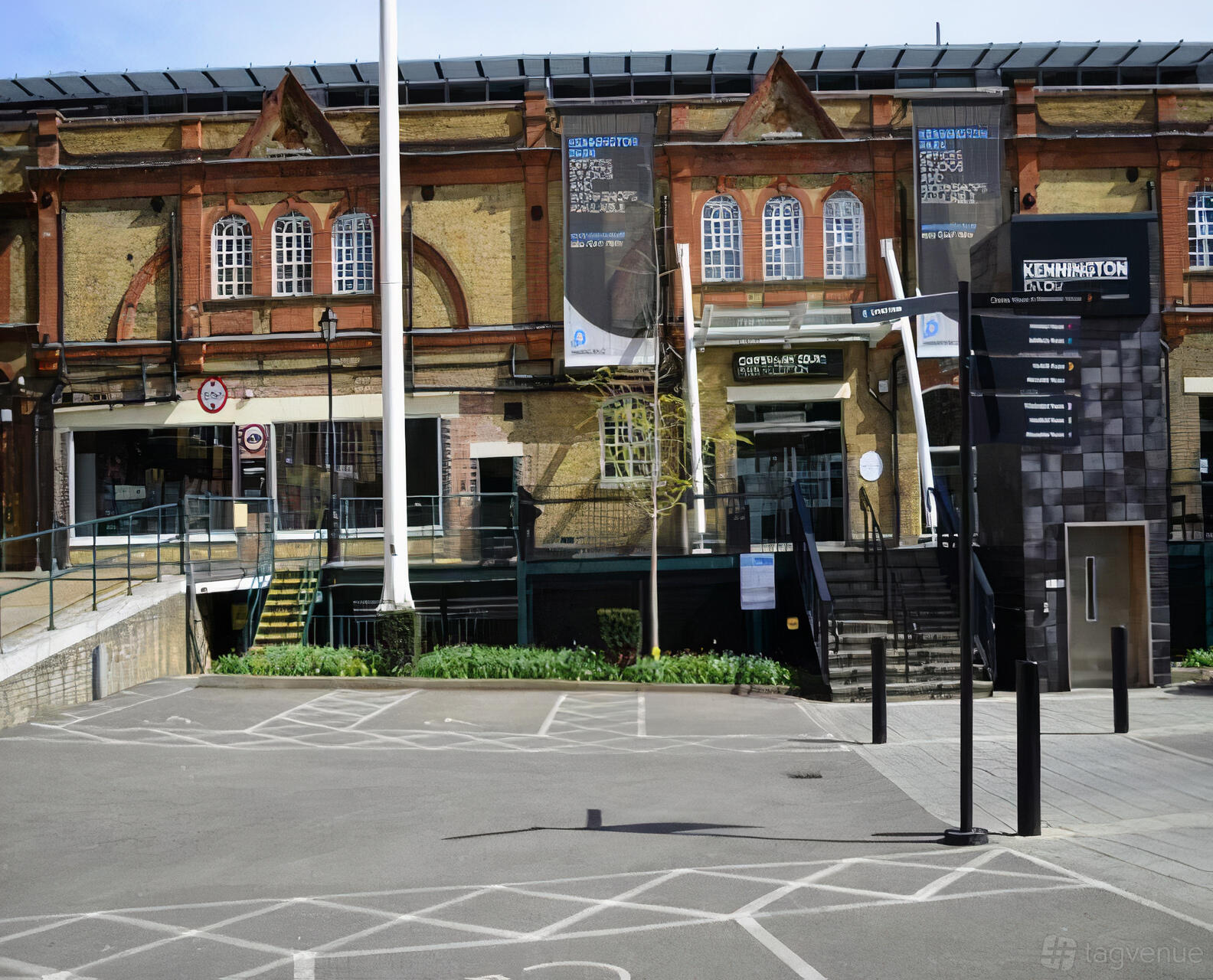 A versatile event space with a brick exterior, large windows, and accessible ramps at UNIT 3.