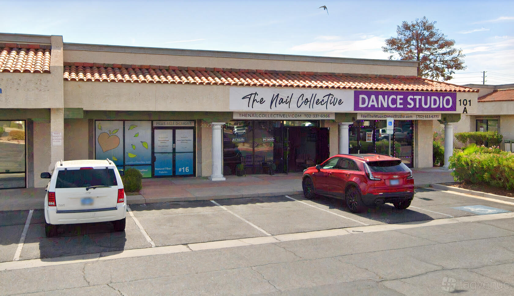 A dance studio with large front windows, a purple sign, and columned entry at Feel The Music Dance Studio.