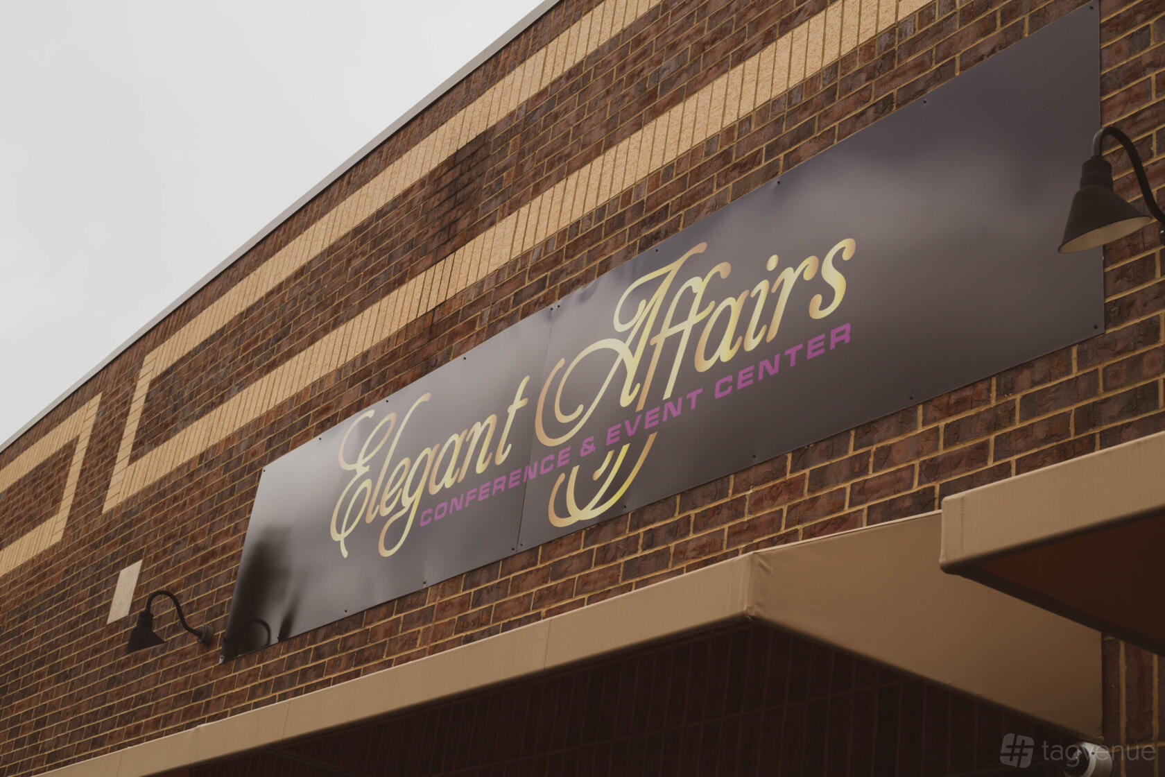 A brown brick building with a large Elegant Affairs Conference & Event Center sign above the entrance.