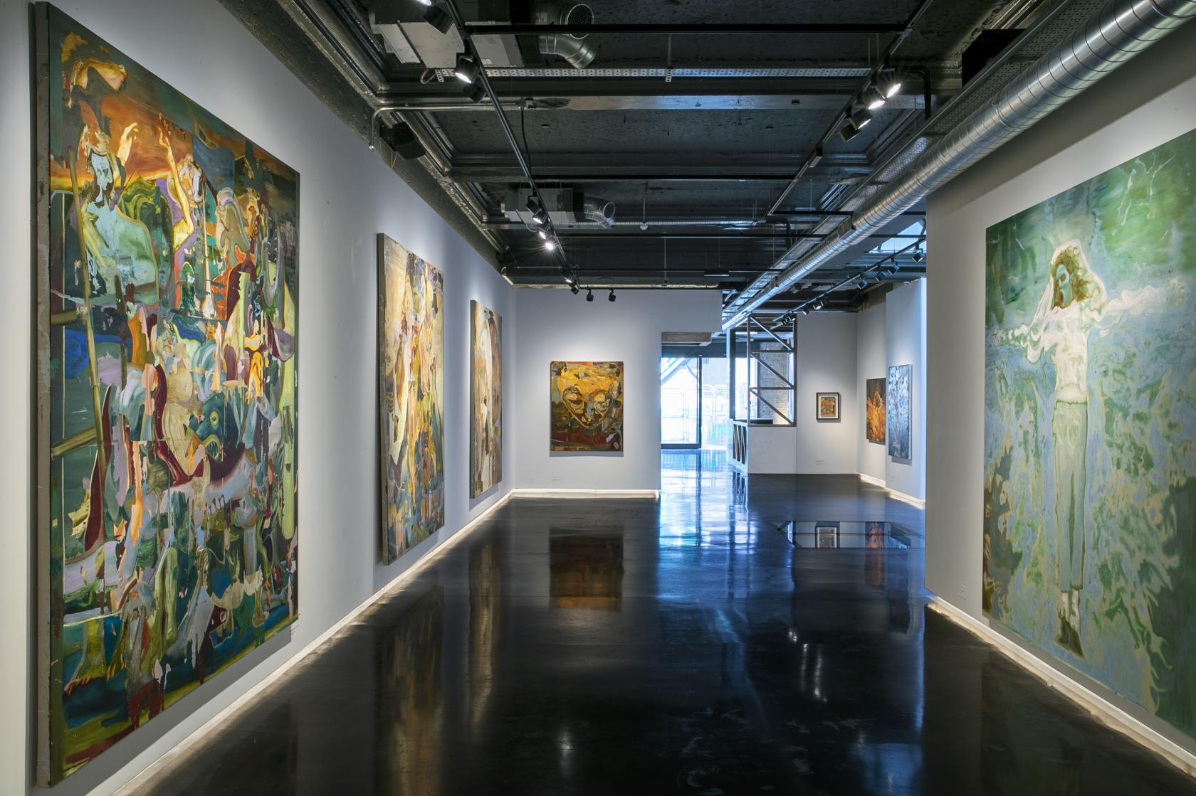 An event venue with polished floors, gallery lighting, and large contemporary art pieces at 3 Hanover Square.