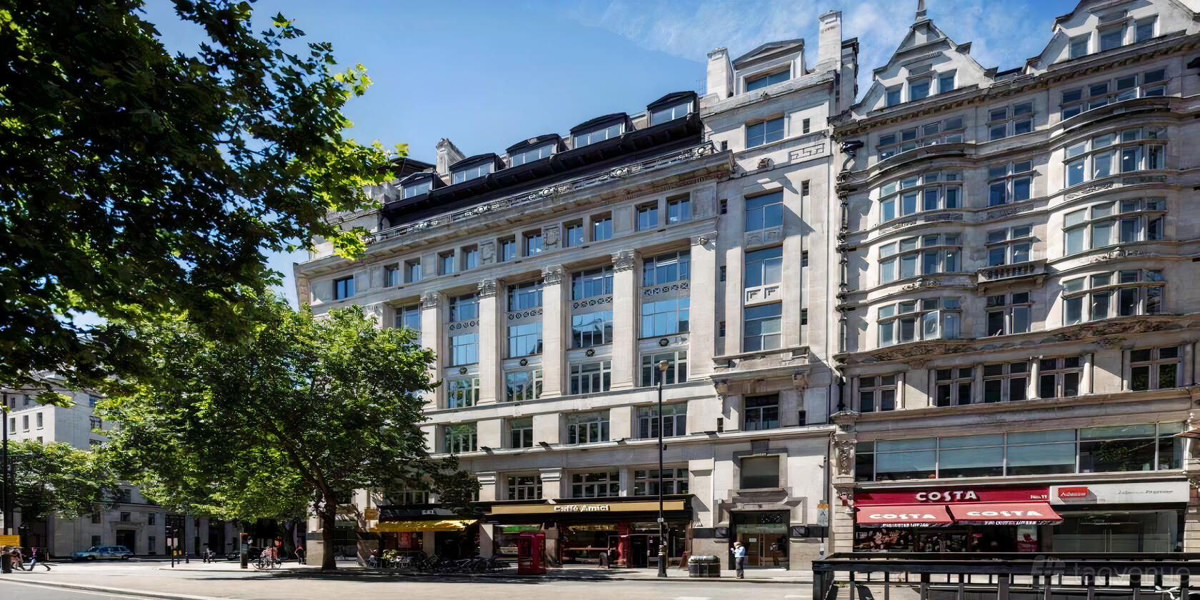 A meeting centre with a white stone facade, large windows, and ground-level cafes at SAGO Europe.