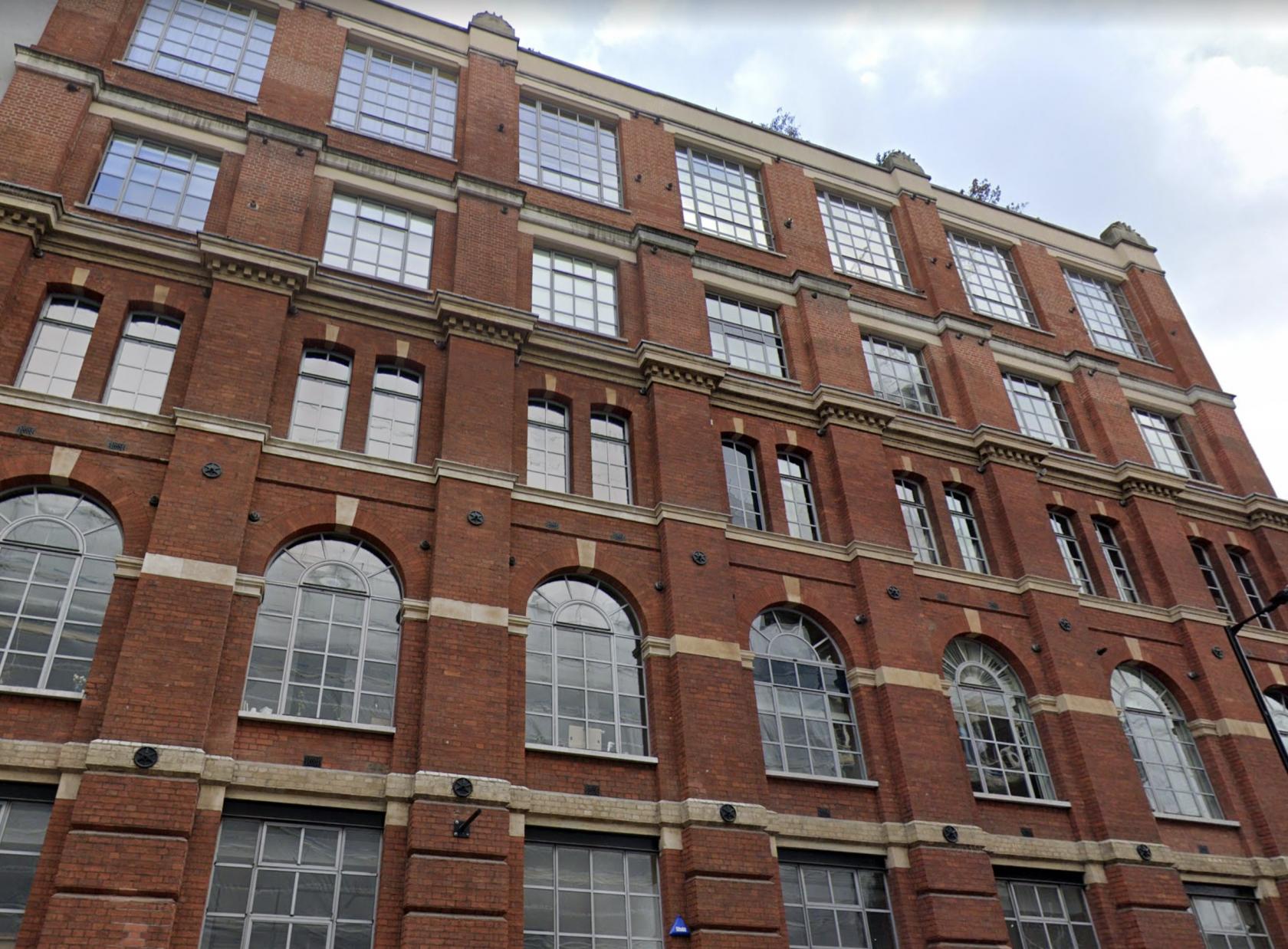 A versatile event space in a red brick building with large arched windows at Lumiere London Southbank.