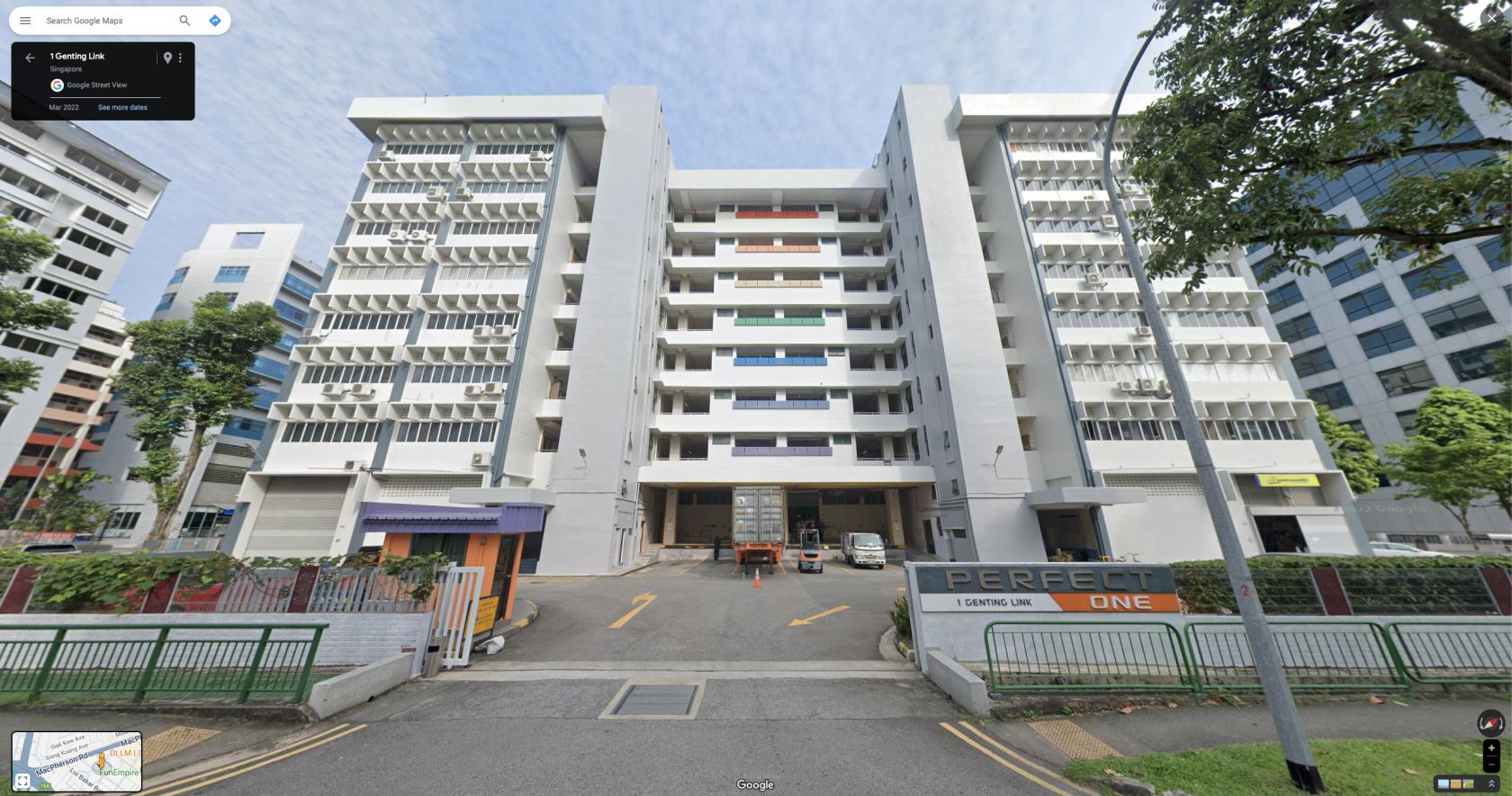 A multi-story building with exterior balconies and ground-level loading bays at Kactus Singapore.