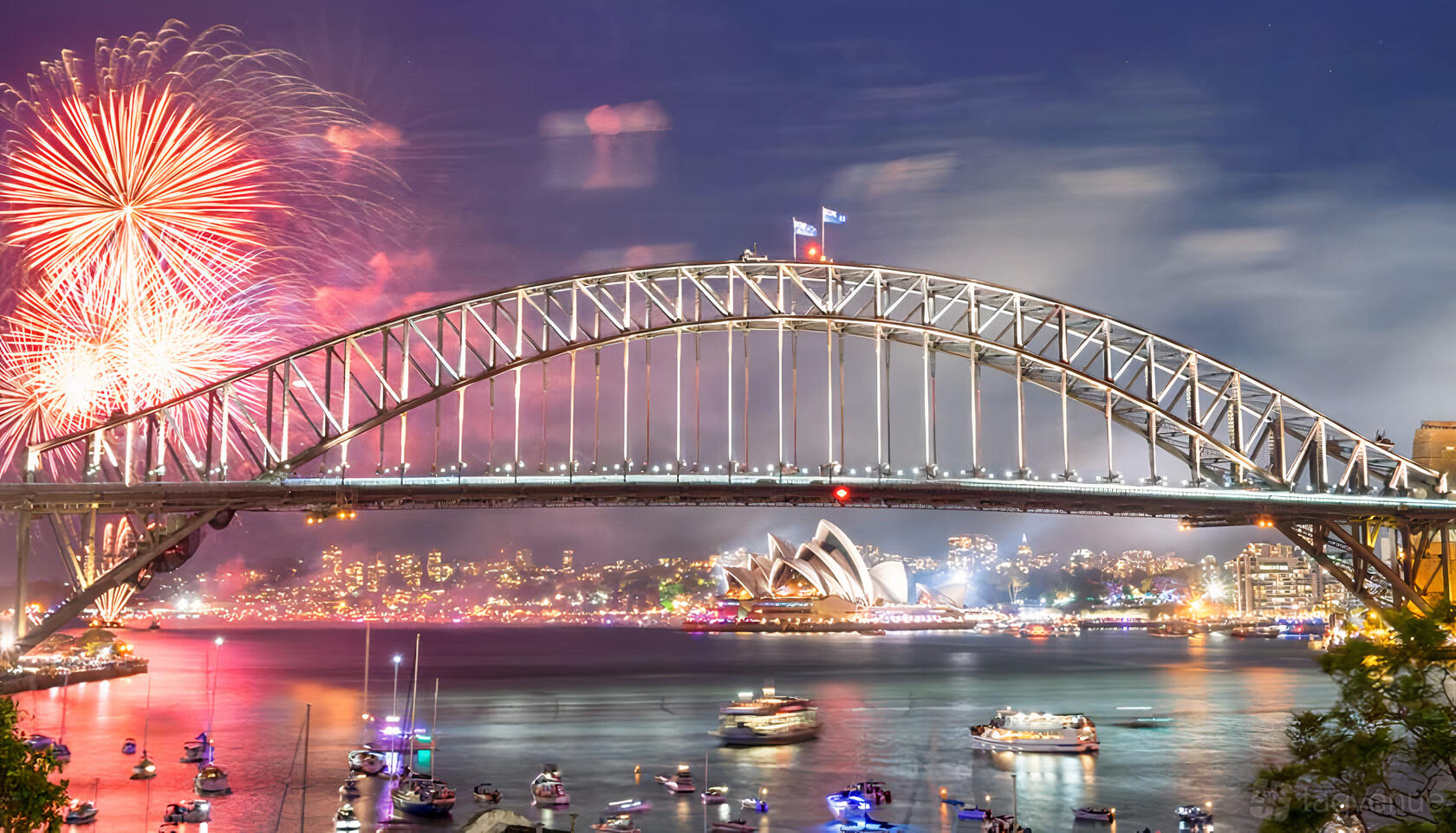 A boat with outdoor seating on the harbor during fireworks and city skyline views at Prestige Harbour Cruises.