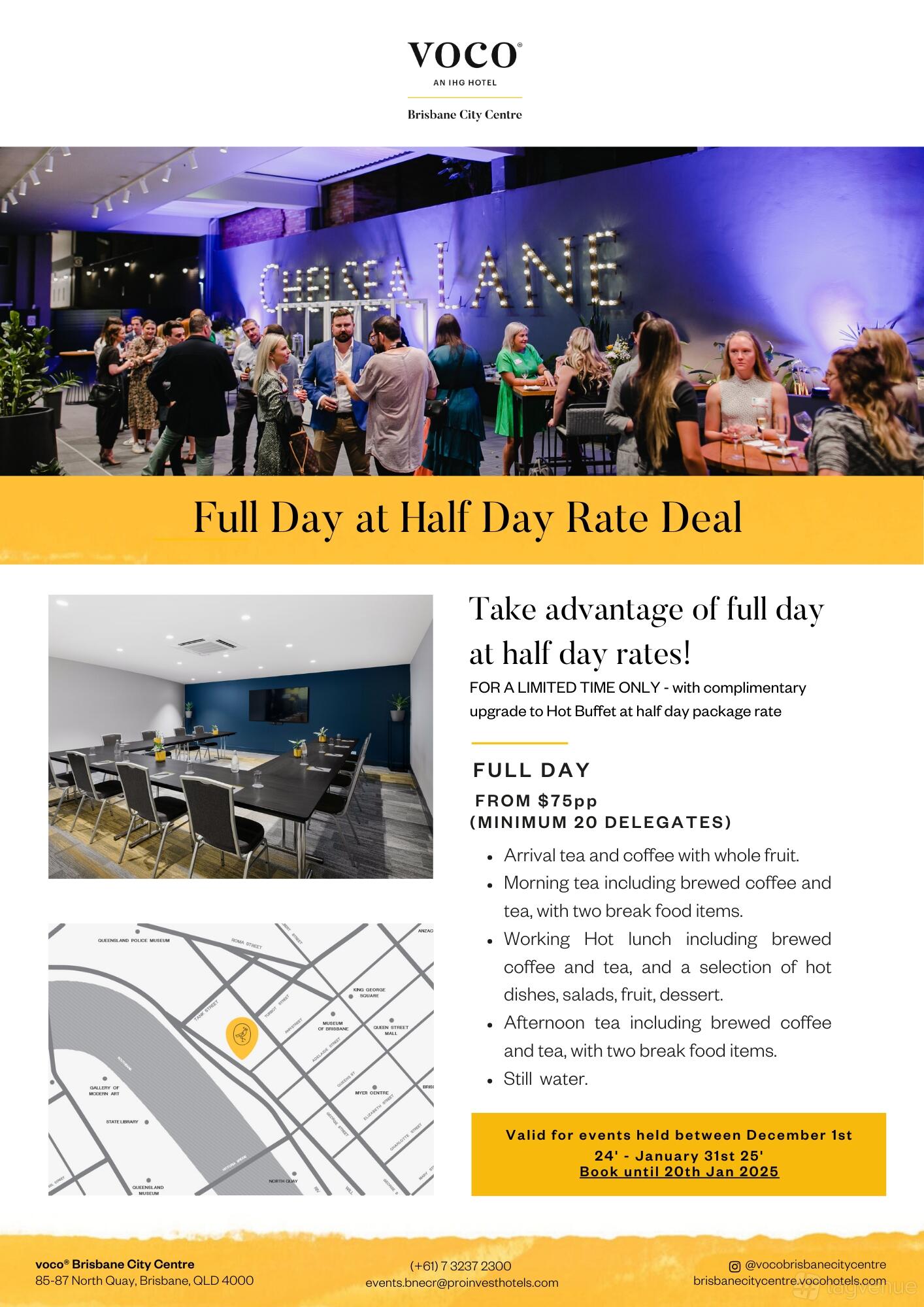 An event space in a hotel with a boardroom table, black chairs, and a wall-mounted screen at Voco Hotel Brisbane City Centre.