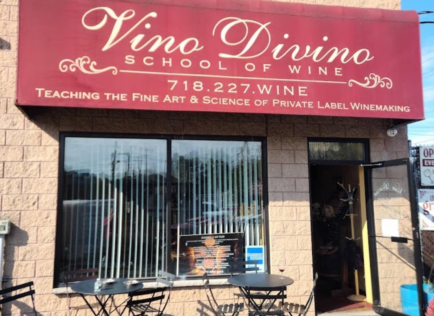 A restaurant exterior with a burgundy sign, brick facade, and outdoor bistro tables at Vino Divino Winery.