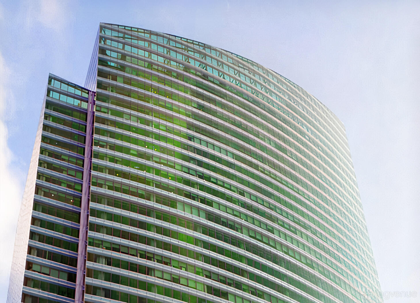 A meeting centre with a glass facade and curved architecture at Ocean Financial Centre.