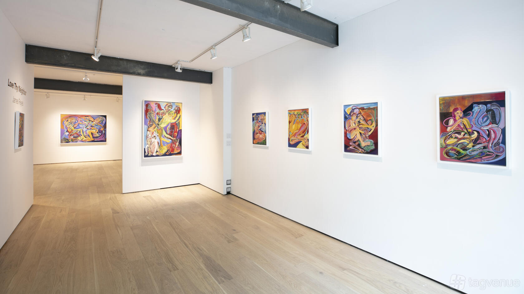 A gallery with white walls, wooden floors, exposed ceiling beams, and colorful paintings at Ki Smith Gallery.
