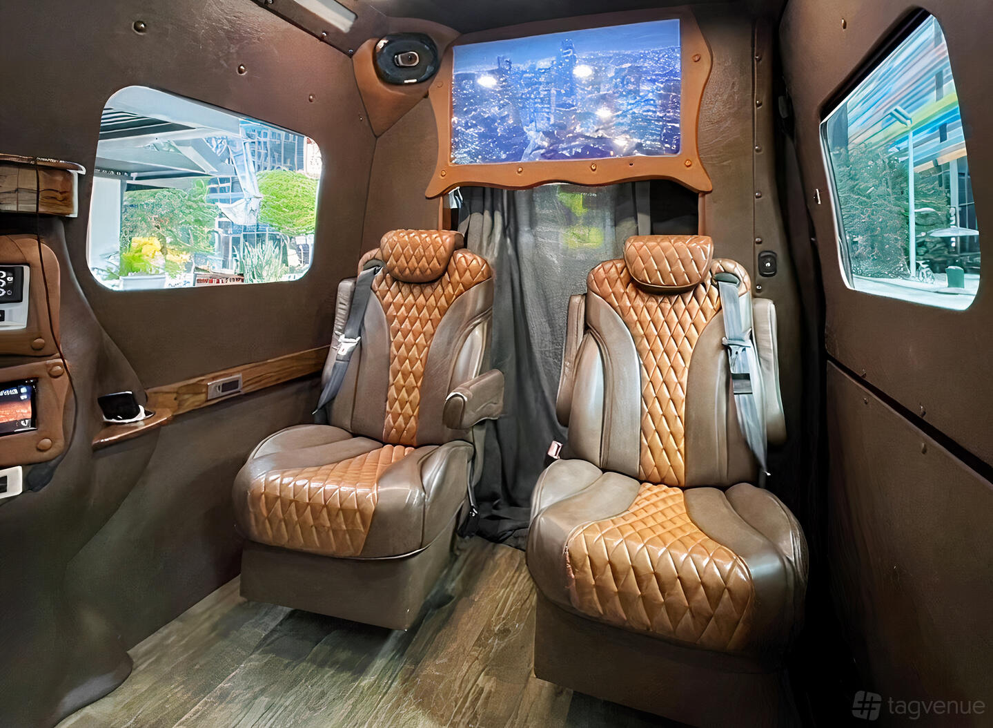 A party bus with quilted leather captain’s chairs, wood floors, and large windows at Luxury Lifestyle Connections.