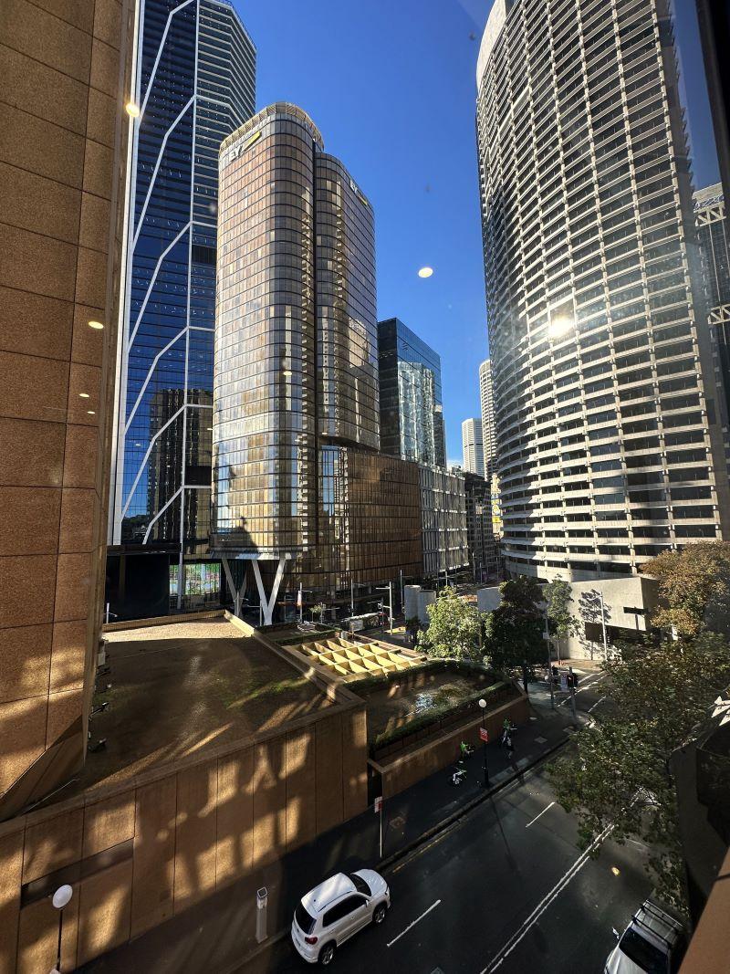 A conference centre with large glass windows offering views of high-rise office buildings at Karstens Sydney.