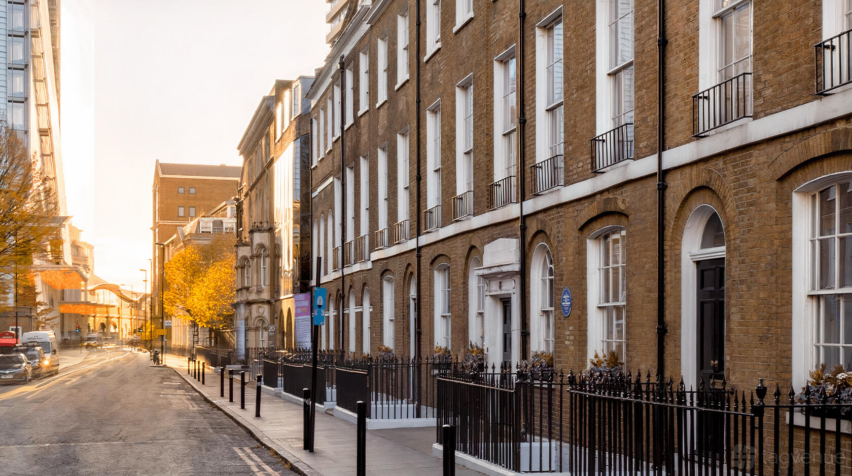 A meeting centre with Georgian brick facade, tall sash windows, and wrought iron railings at Guy's and St Thomas' Hospital.