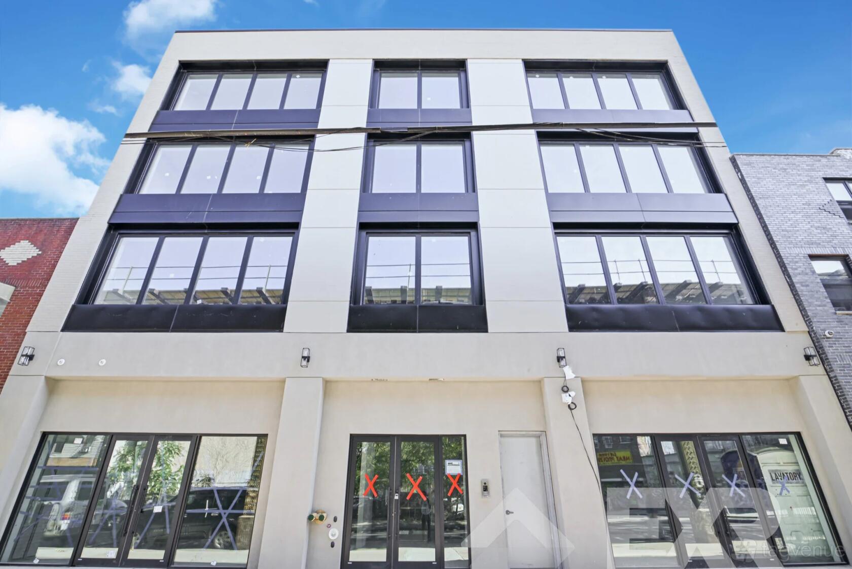 A contemporary event space with large glass windows on a multi-story facade at Cityscape Event Spaces.