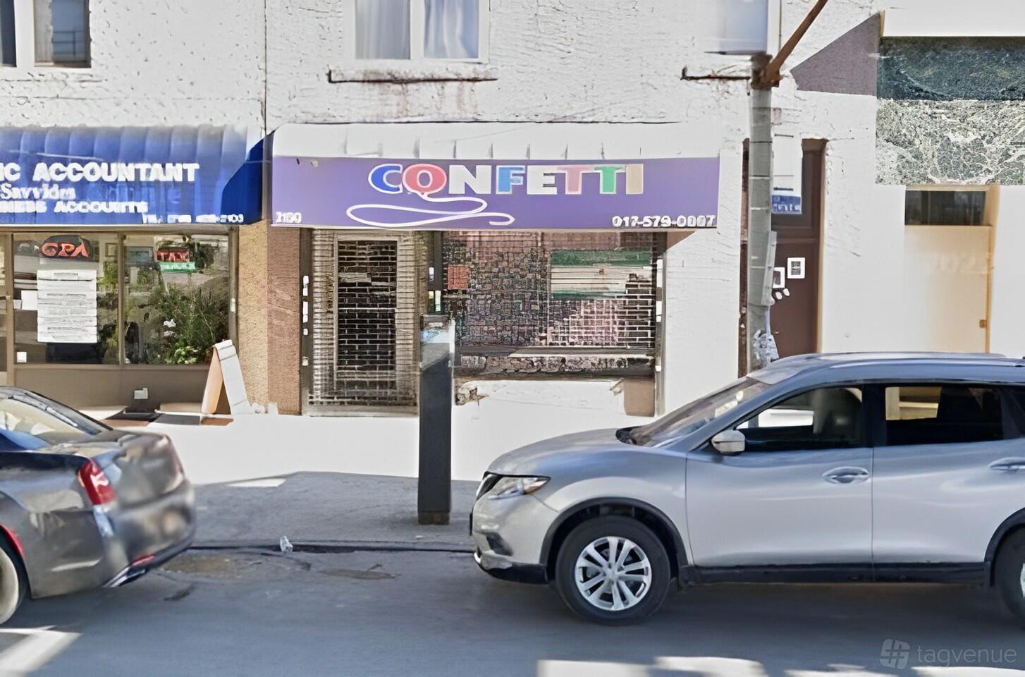 The exterior of a versatile event space with a colorful awning and street-facing entrance at Confetti Party Place.