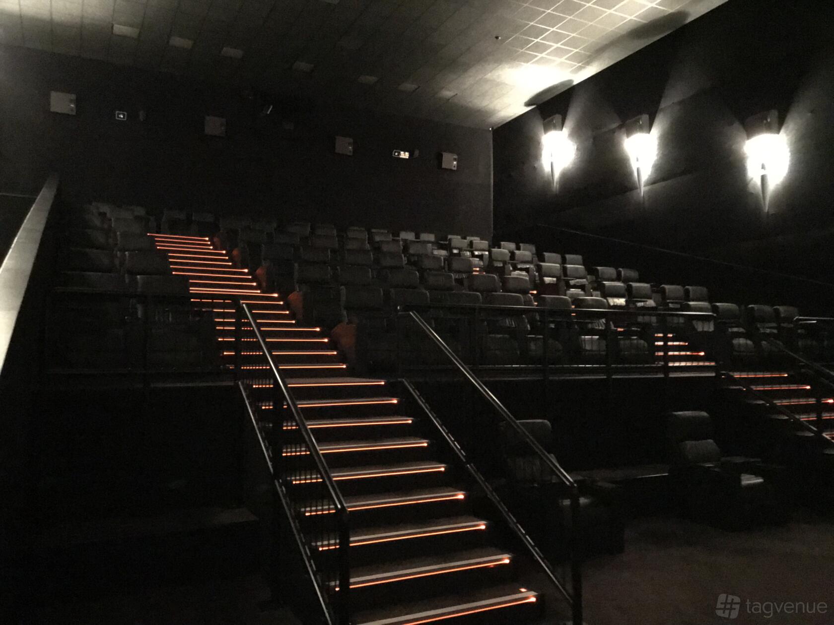 A cinema screening room with tiered seating and illuminated stair lights at Vue Basingstoke.