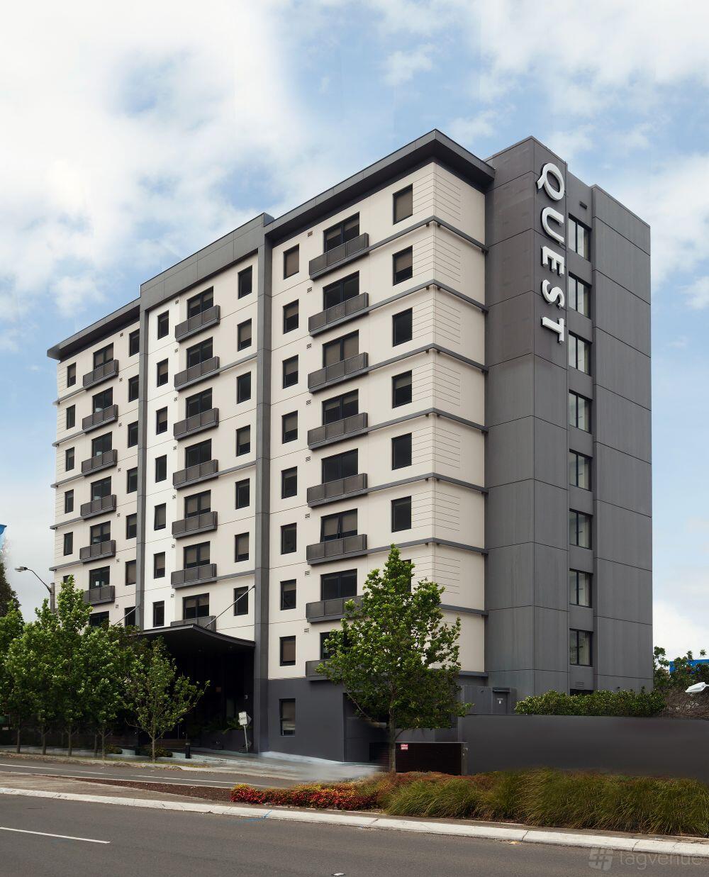 A multi-storey hotel with private balconies and large windows at Quest Mascot.