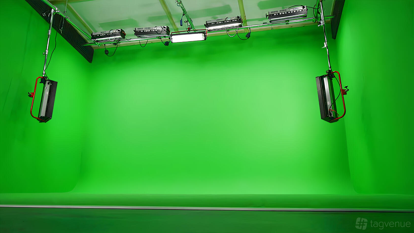 A film studio with an extensive green screen cyclorama and overhead studio lighting at Galleon Studios.