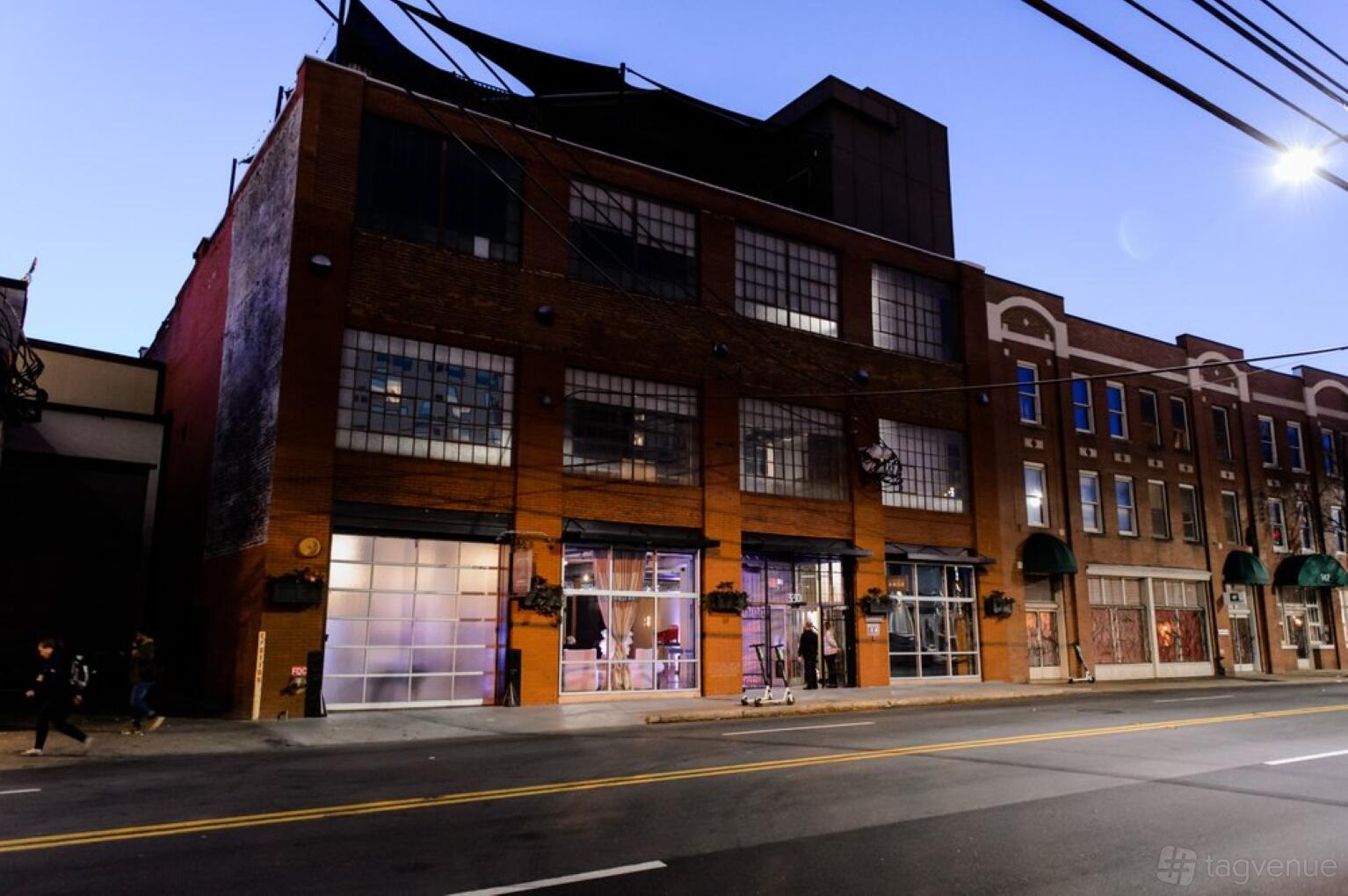 A brick hall with large industrial windows and glass doors at Terminus 330.