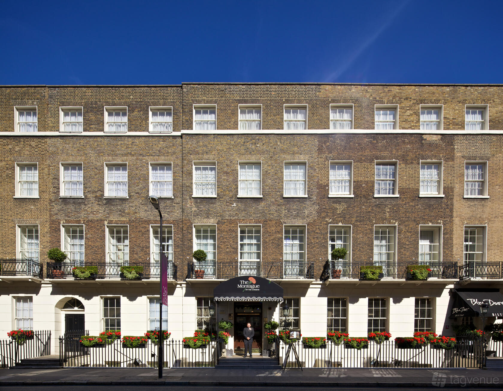 A versatile event space in a Georgian townhouse with brick facade, sash windows, and wrought iron balconies at The Montague on the Gardens.