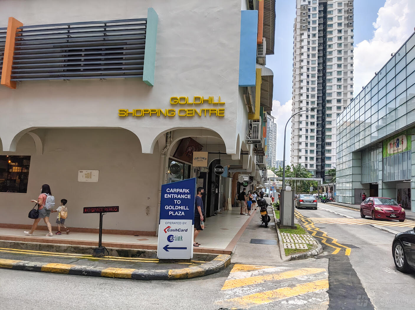 A versatile event space with a street-level corner entrance and signage at Groove Music School.