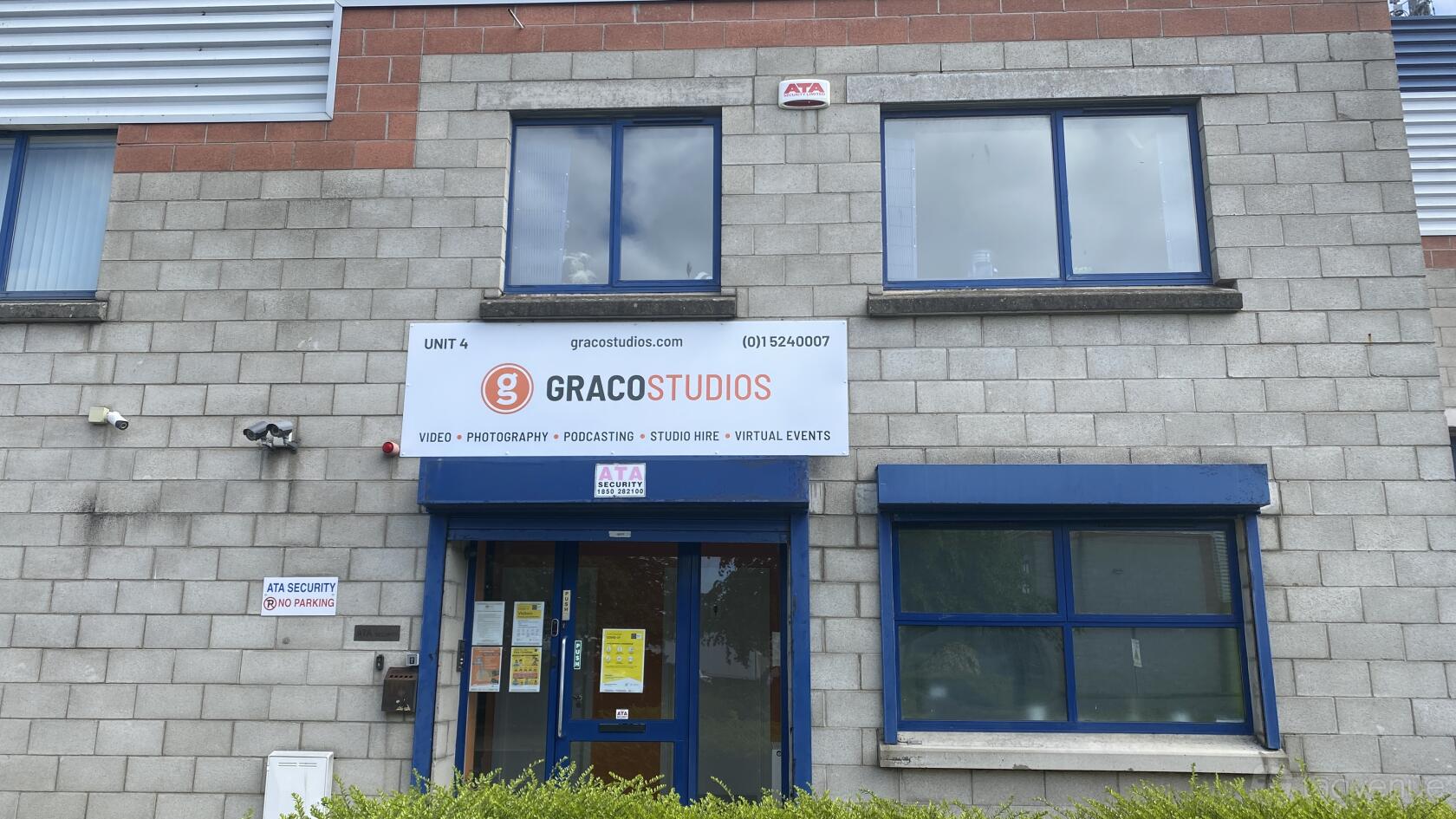 A film and photo studio with a prominent sign and blue-framed windows at Graco Studios.
