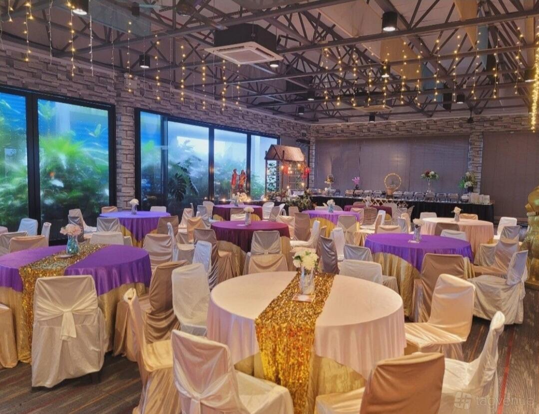 A hall with draped round tables, gold sequin runners, ceiling fairy lights, and large windows at Thirsty Horse Event Hall.