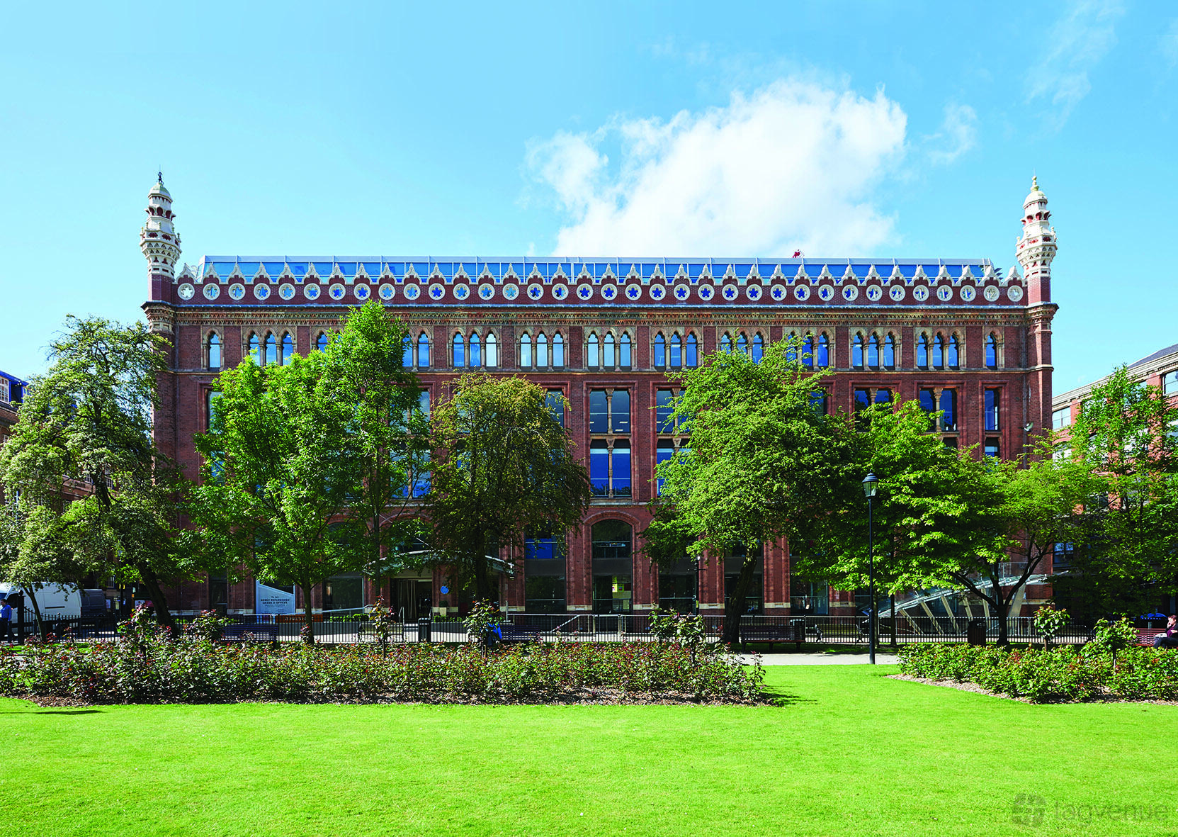 A historic red-brick meeting centre with ornate roof details and large windows at Orega Leeds.