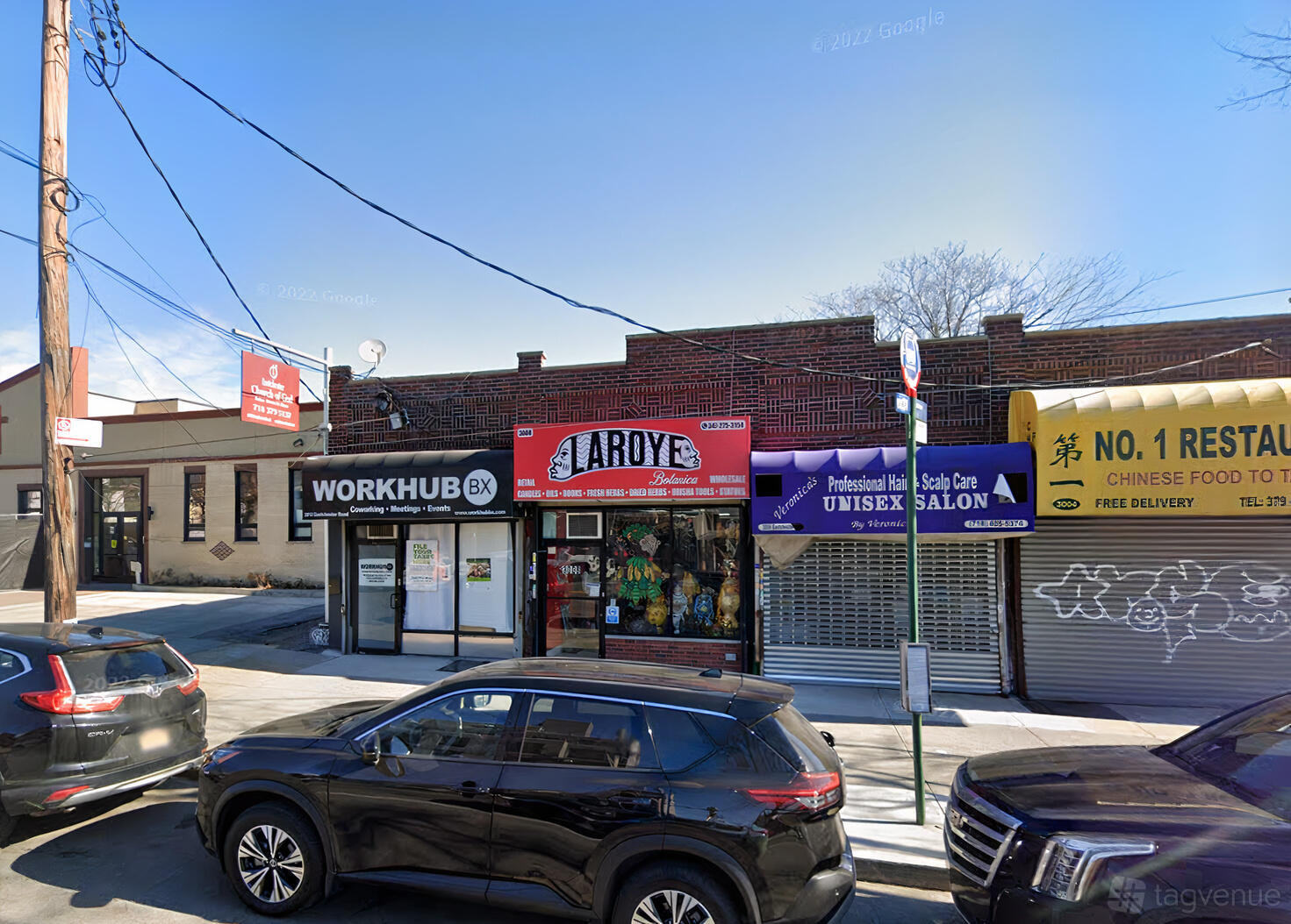 A versatile event space with a brick storefront and large windows at Workhub BX Collab.
